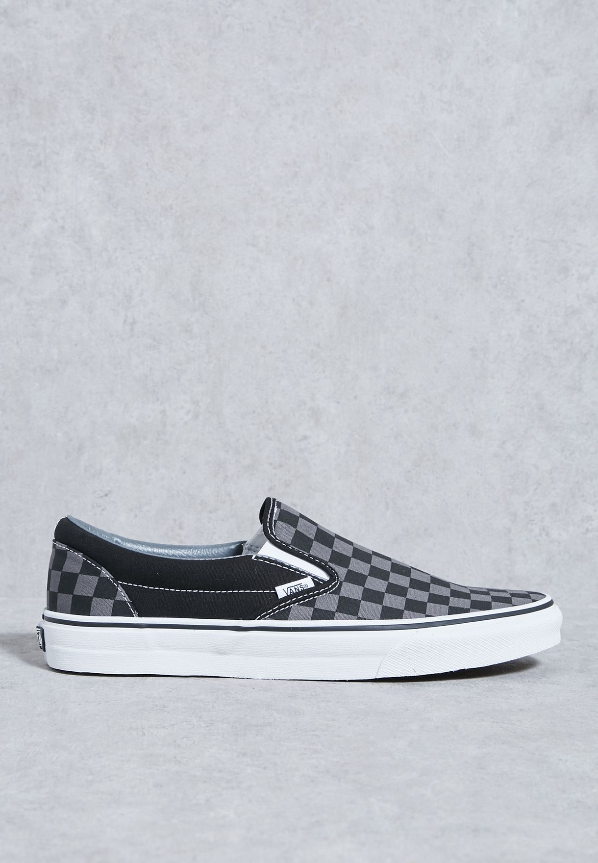 vans black on black checkerboard slip ons