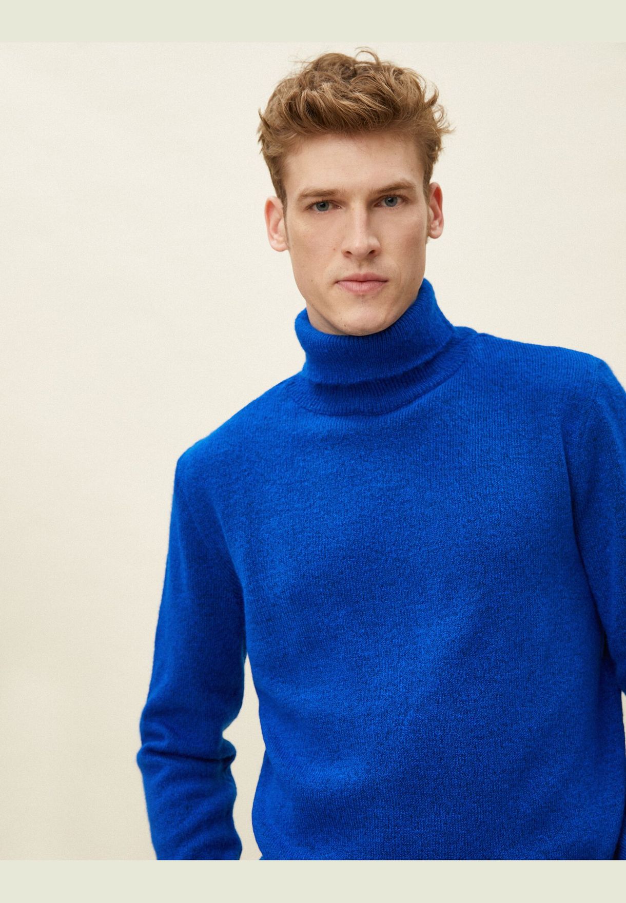 blue polo neck jumper