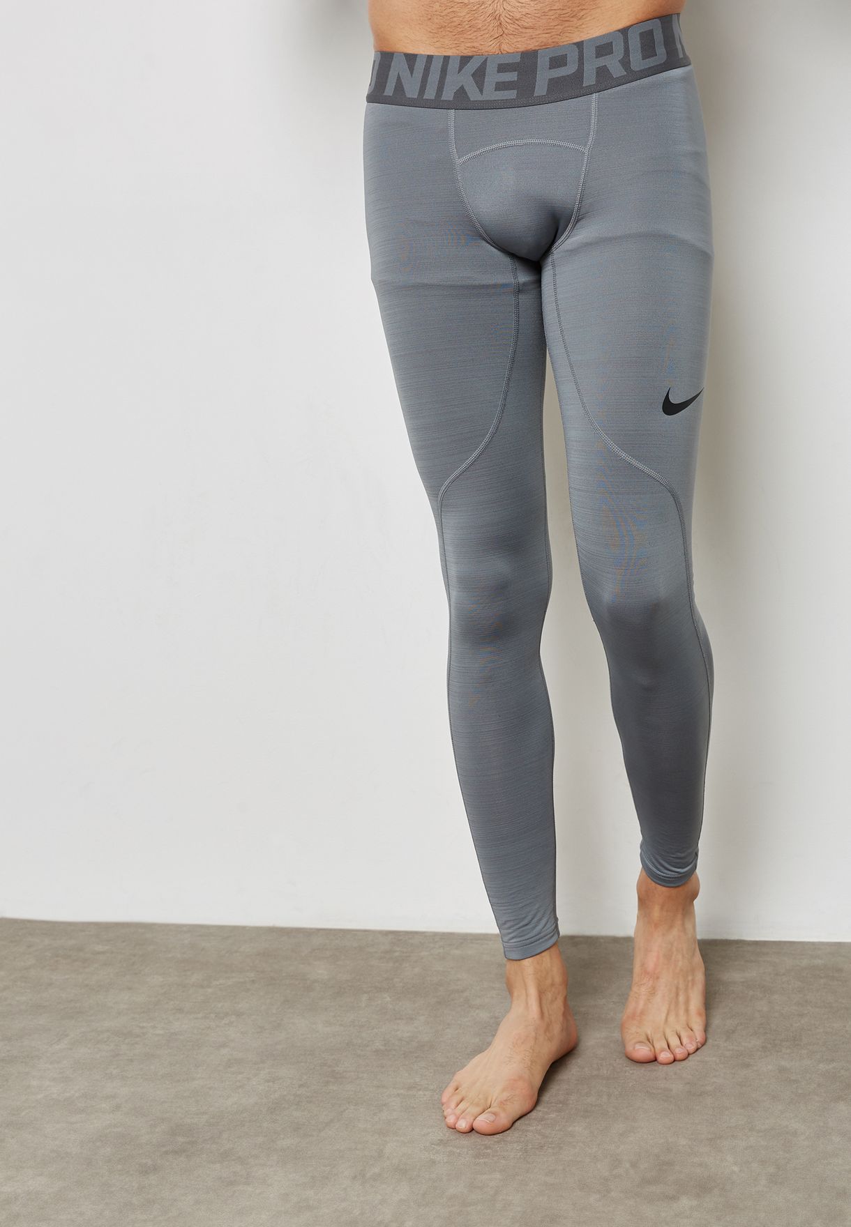 Buy Nike grey Pro Warm Tights for Men 