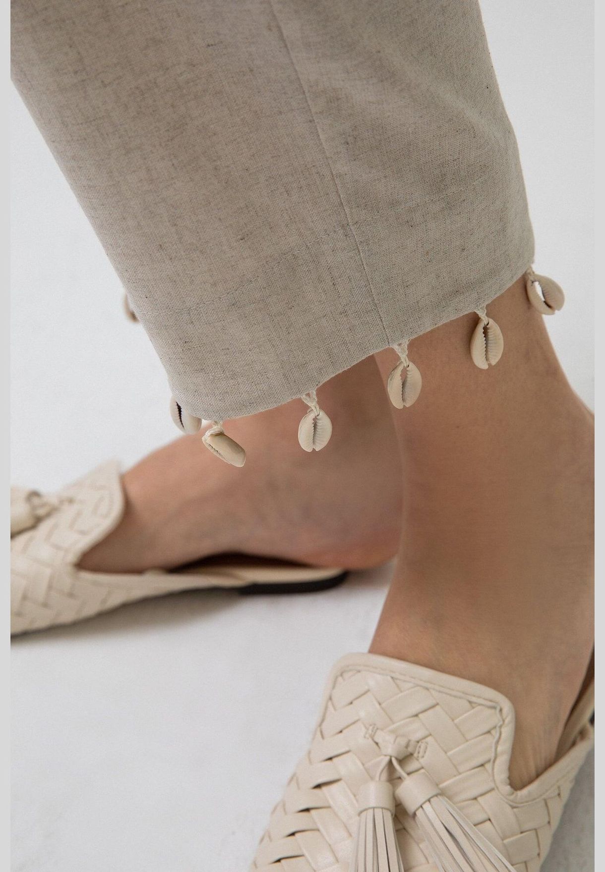 LINEN TROUSERS WITH COWRIE