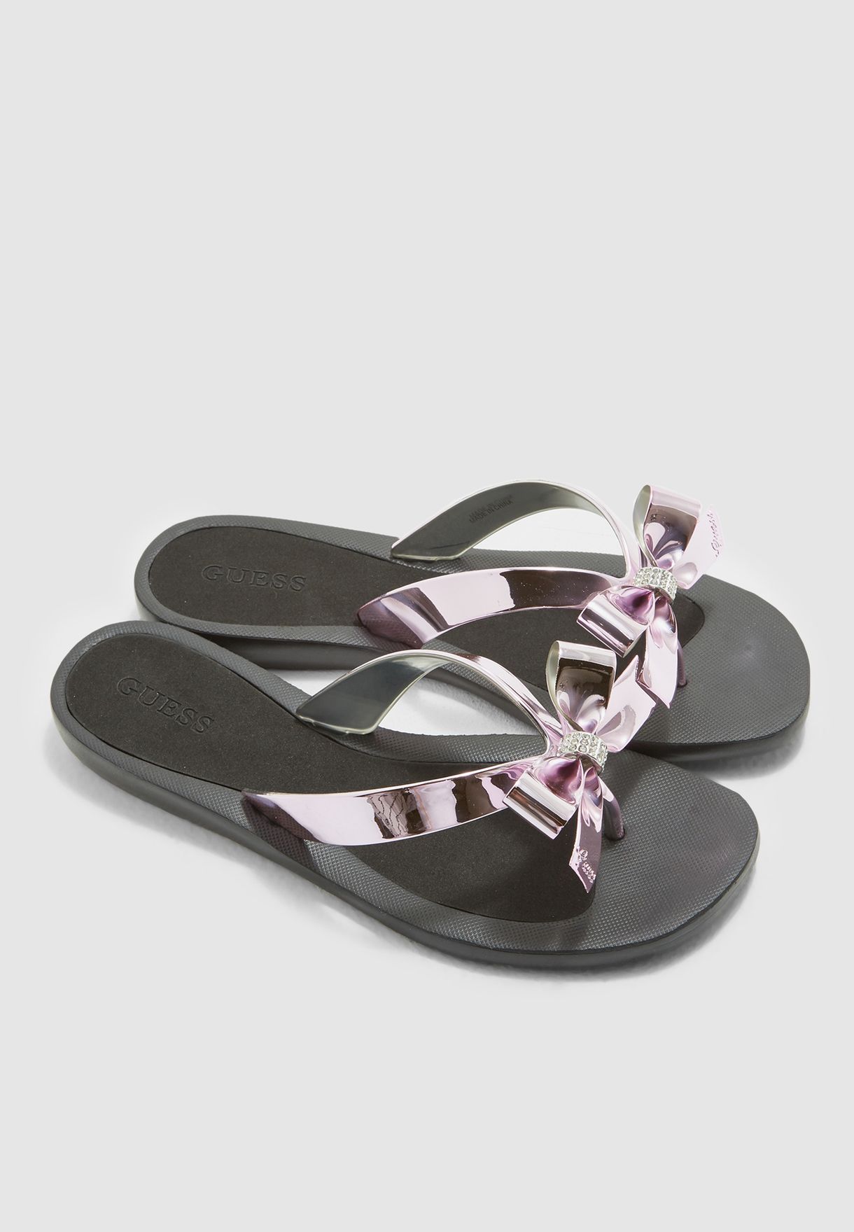 guess black flip flops with bow