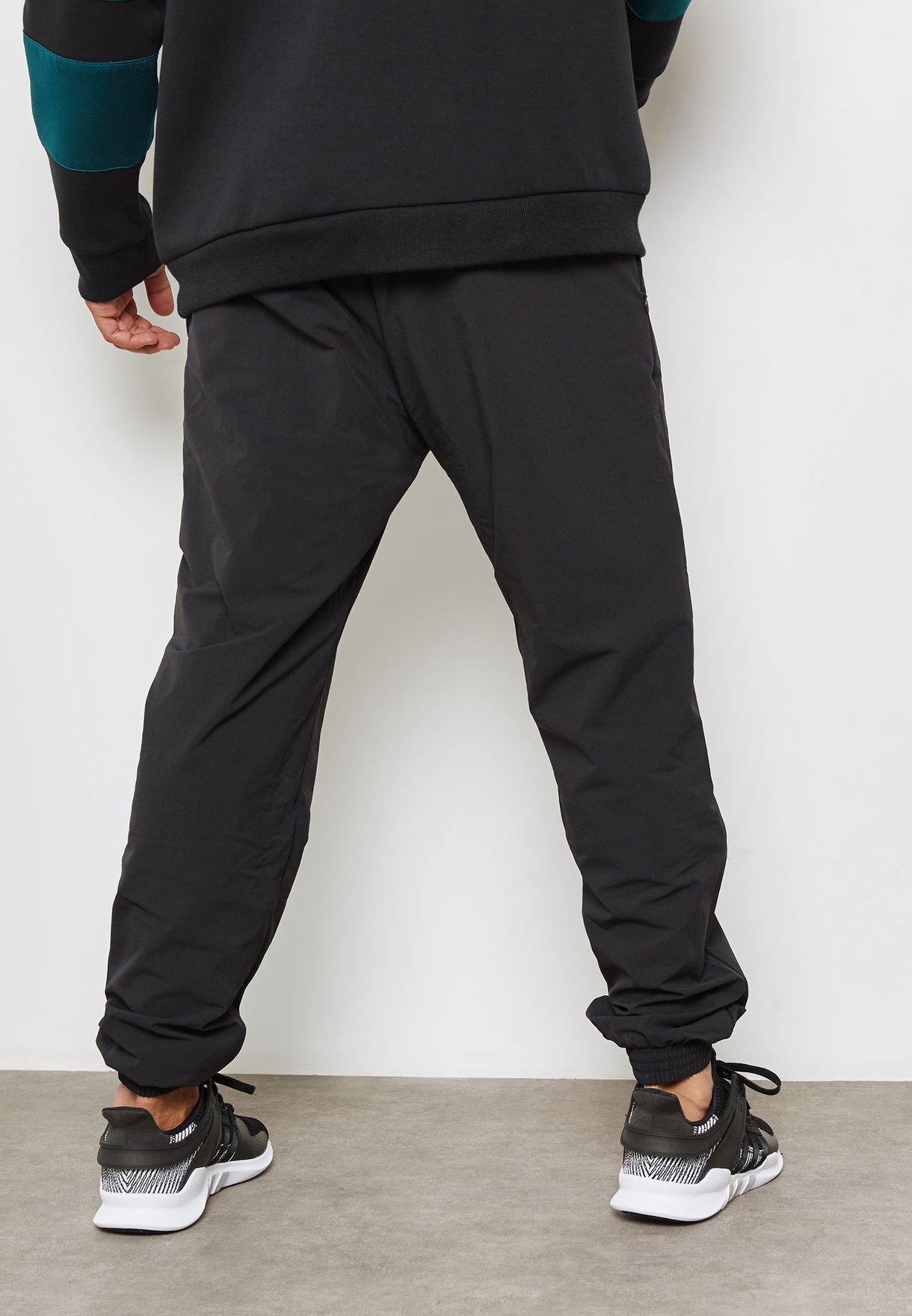 Buy adidas Originals black EQT Cuffed Sweatpants for Men in MENA, Worldwide