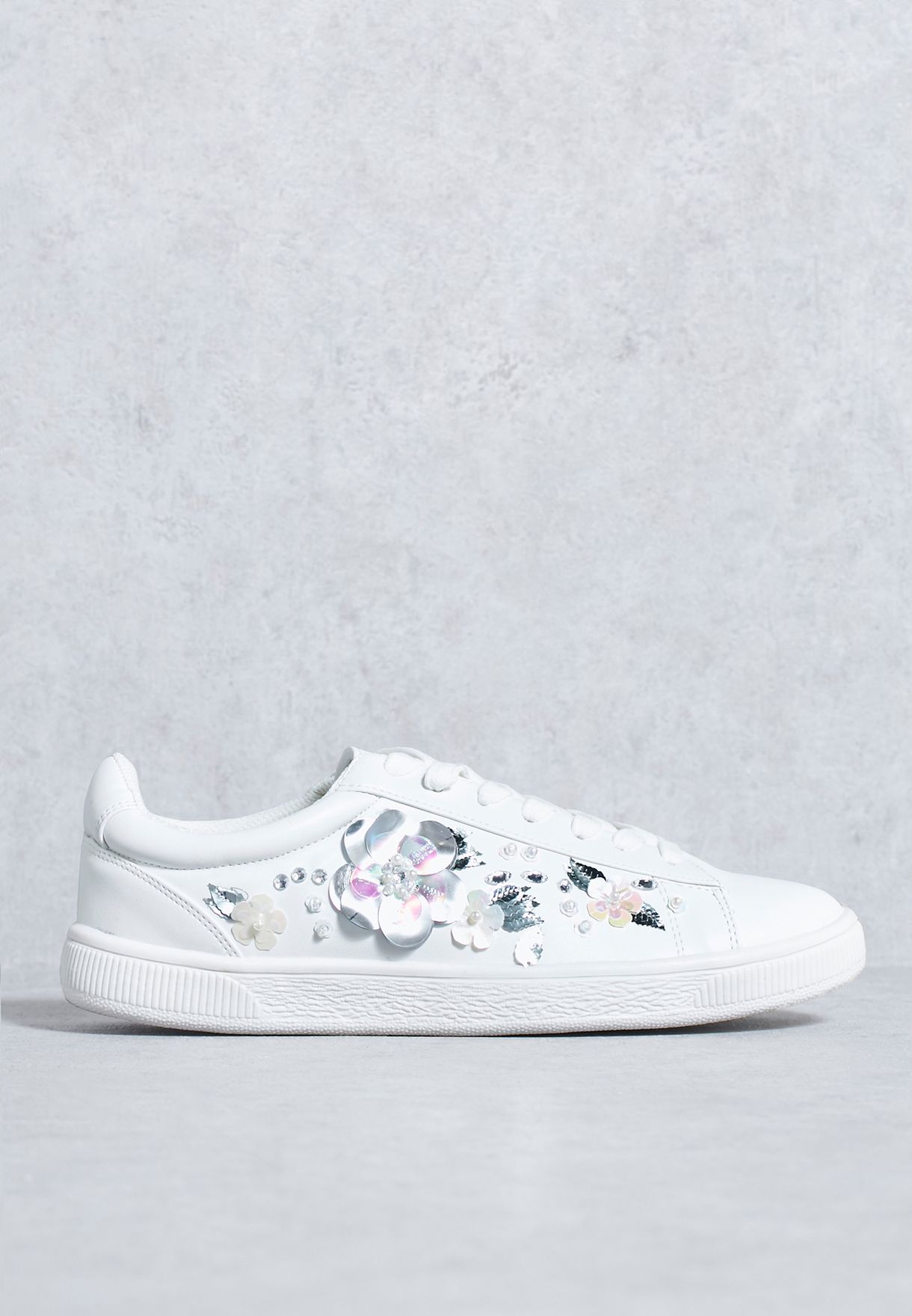 converse floral embellished sneakers