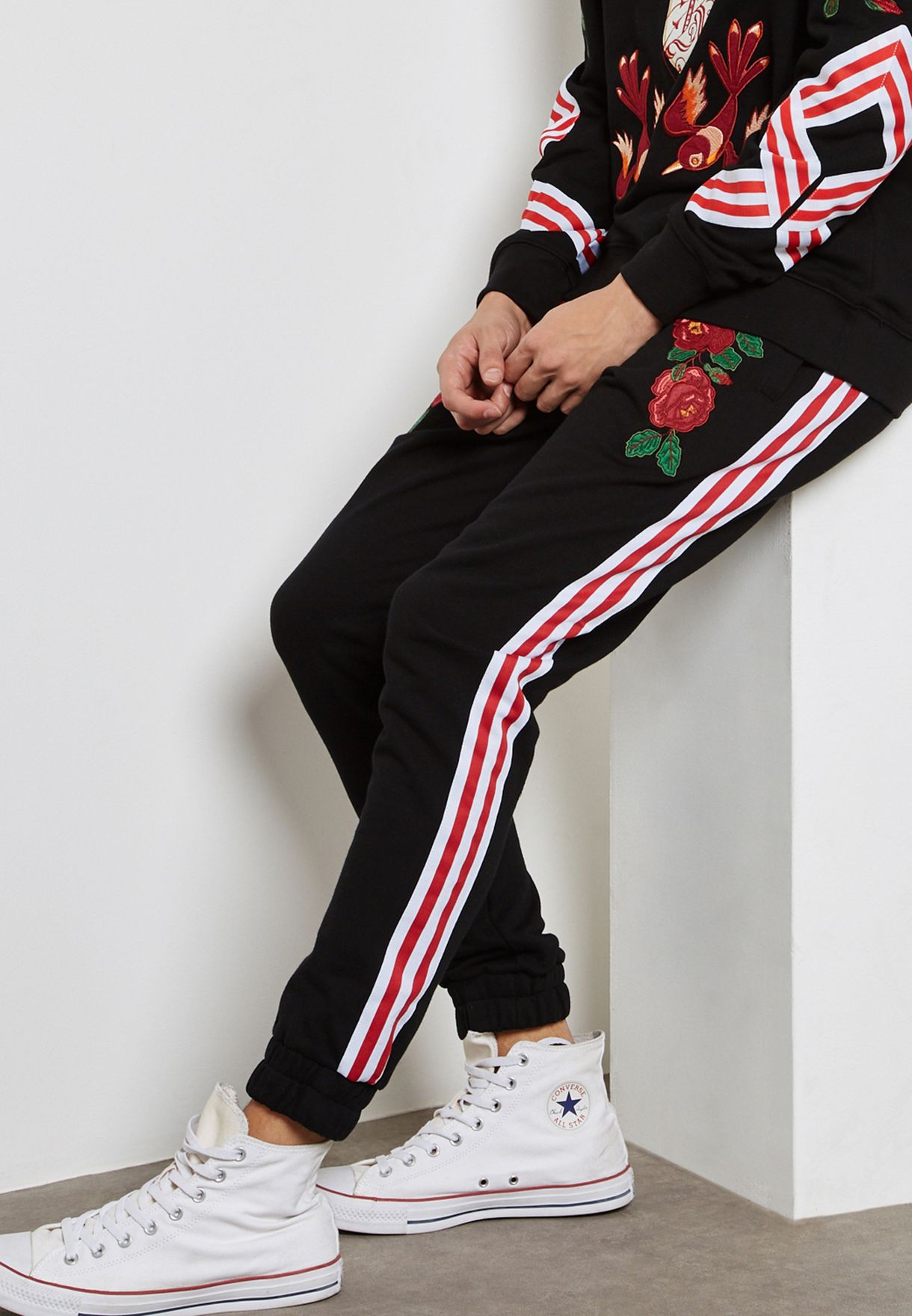 red and black adidas sweatpants