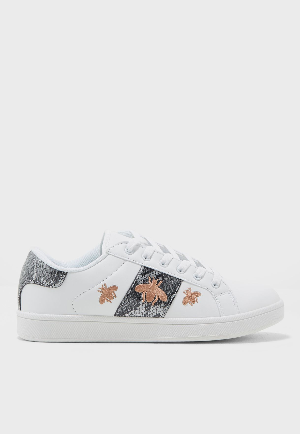 white embroidered trainers