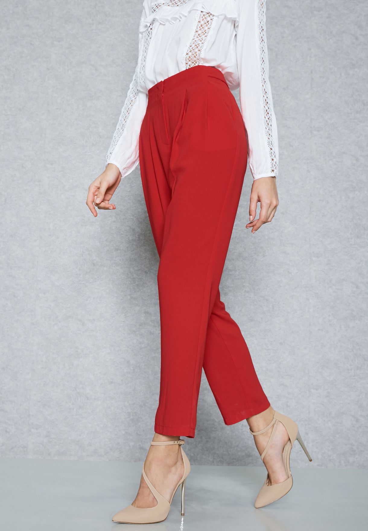 red pleated pants