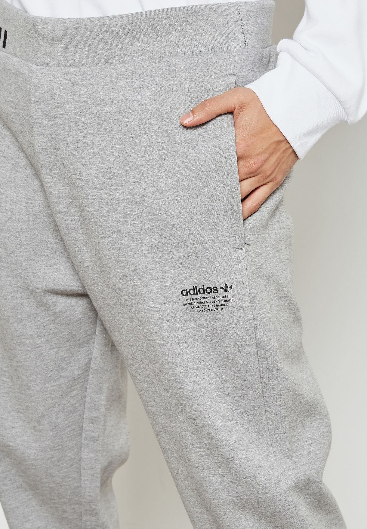 the brand with the three stripes sweatpants