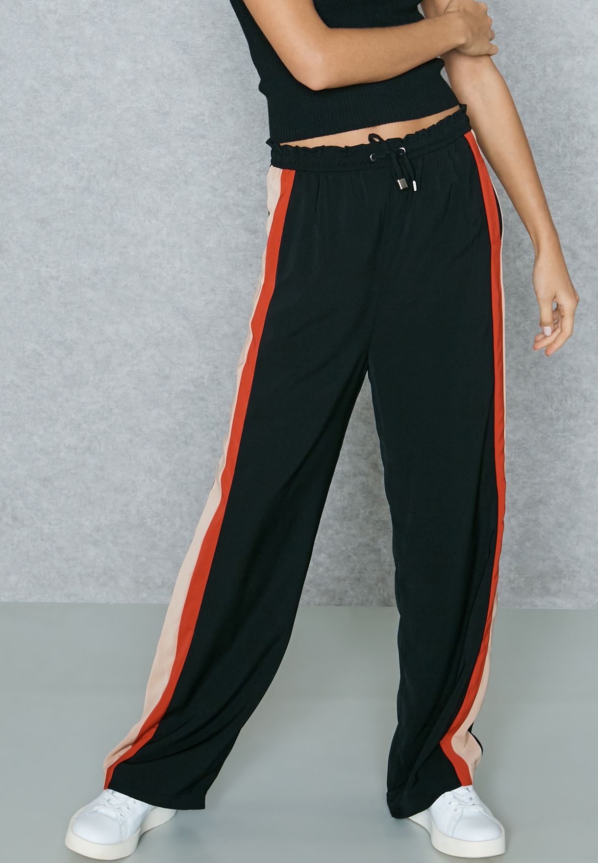 black trousers with neon stripe
