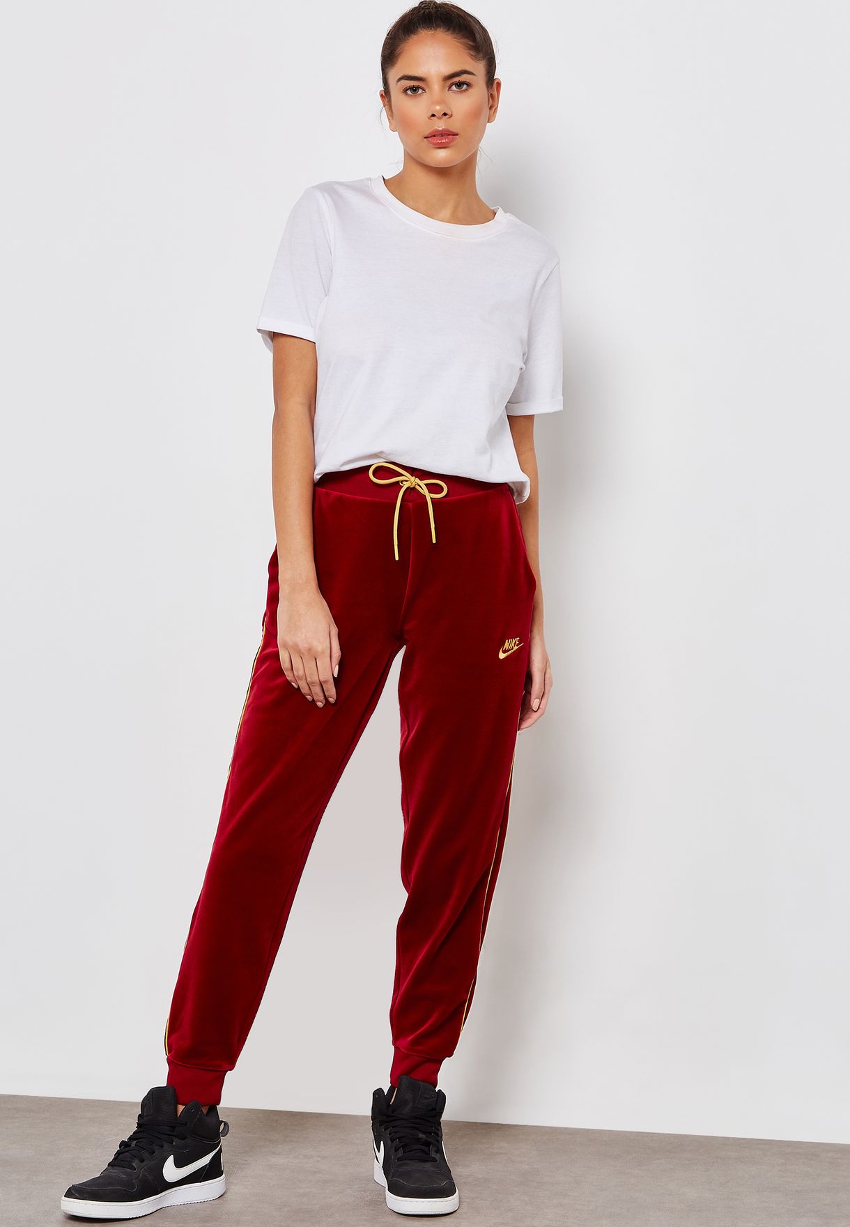 Buy Nike burgundy NSW Velour Sweatpants for Women in MENA, Worldwide