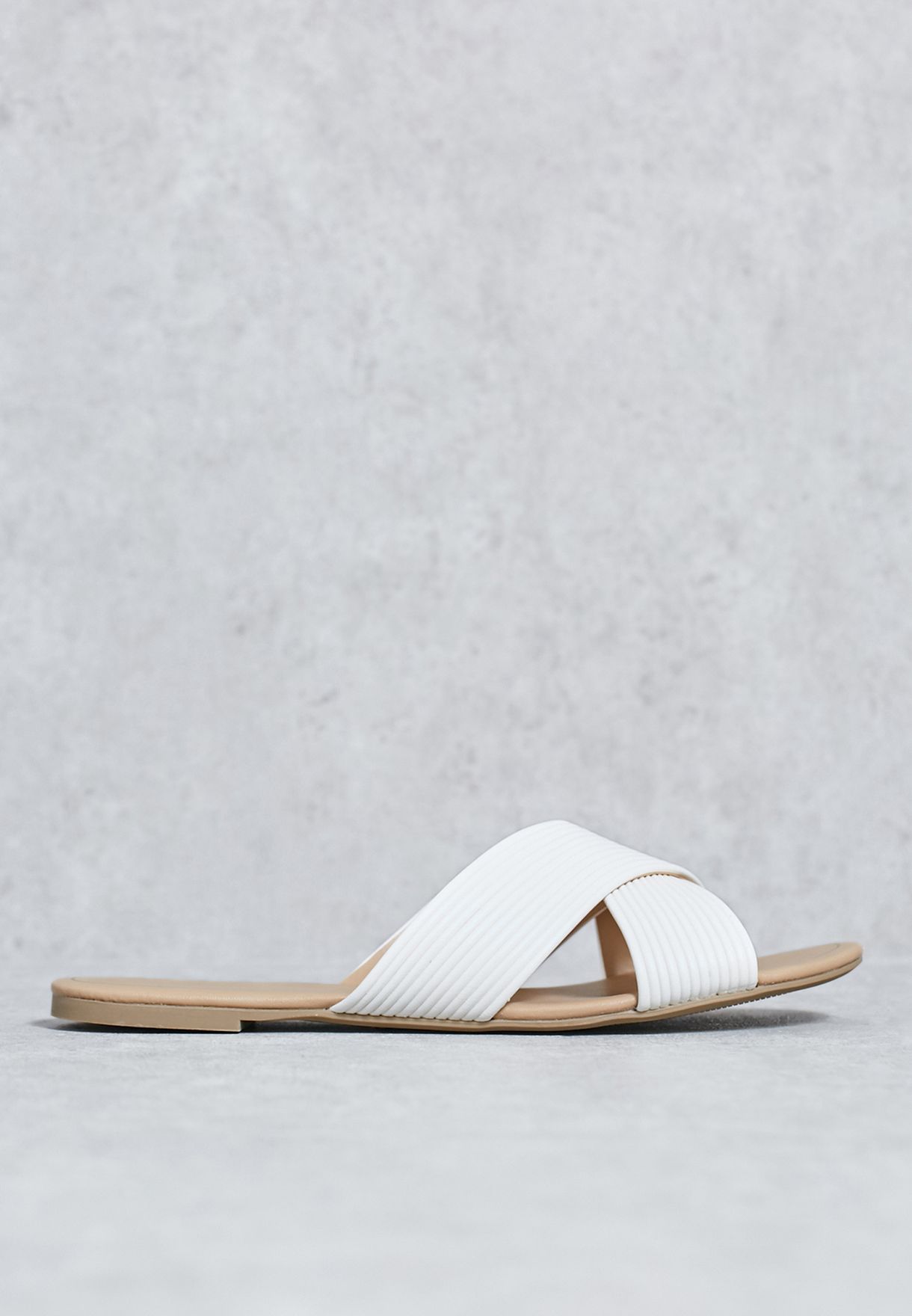 white criss cross slippers