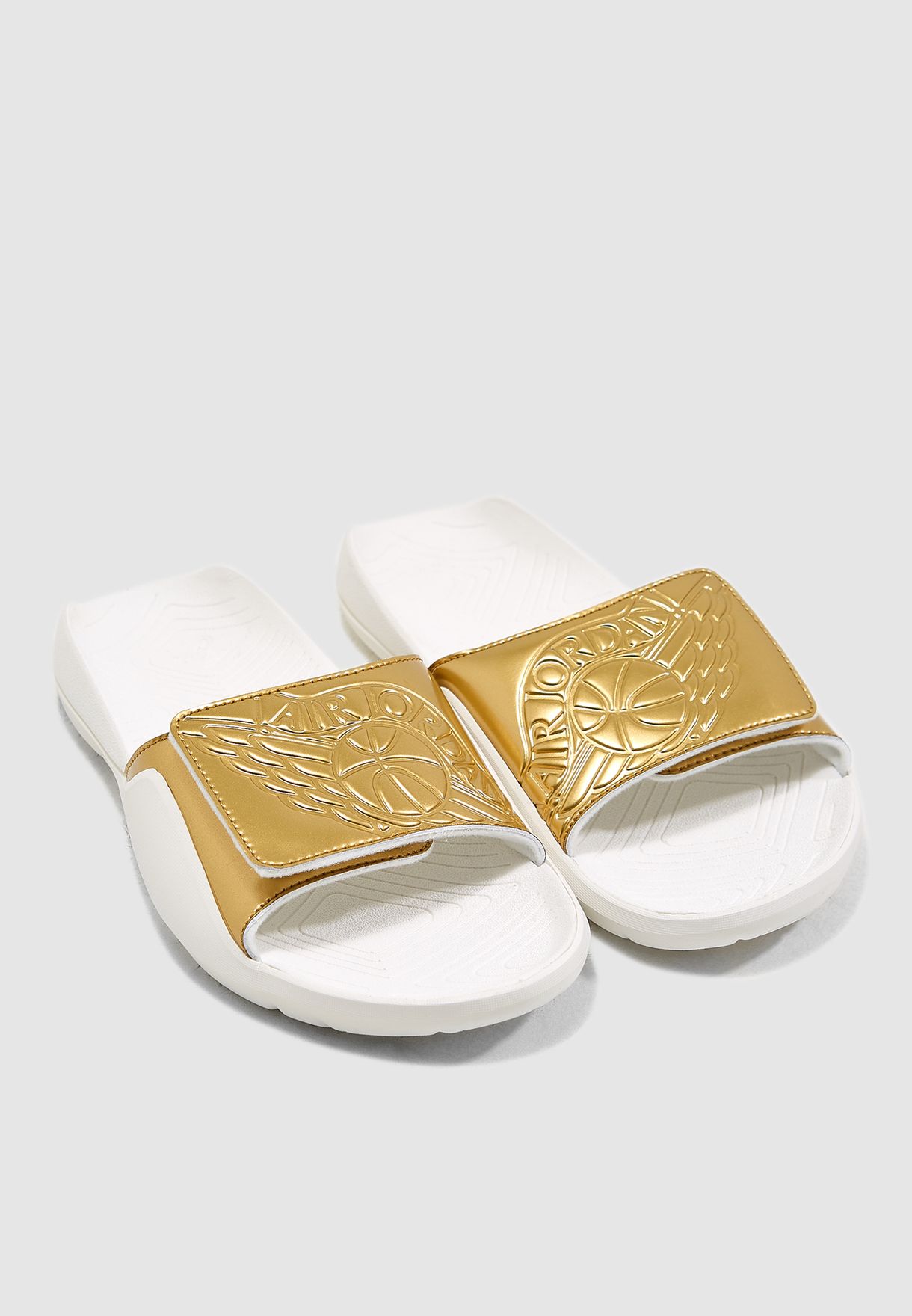 white and gold jordan slides