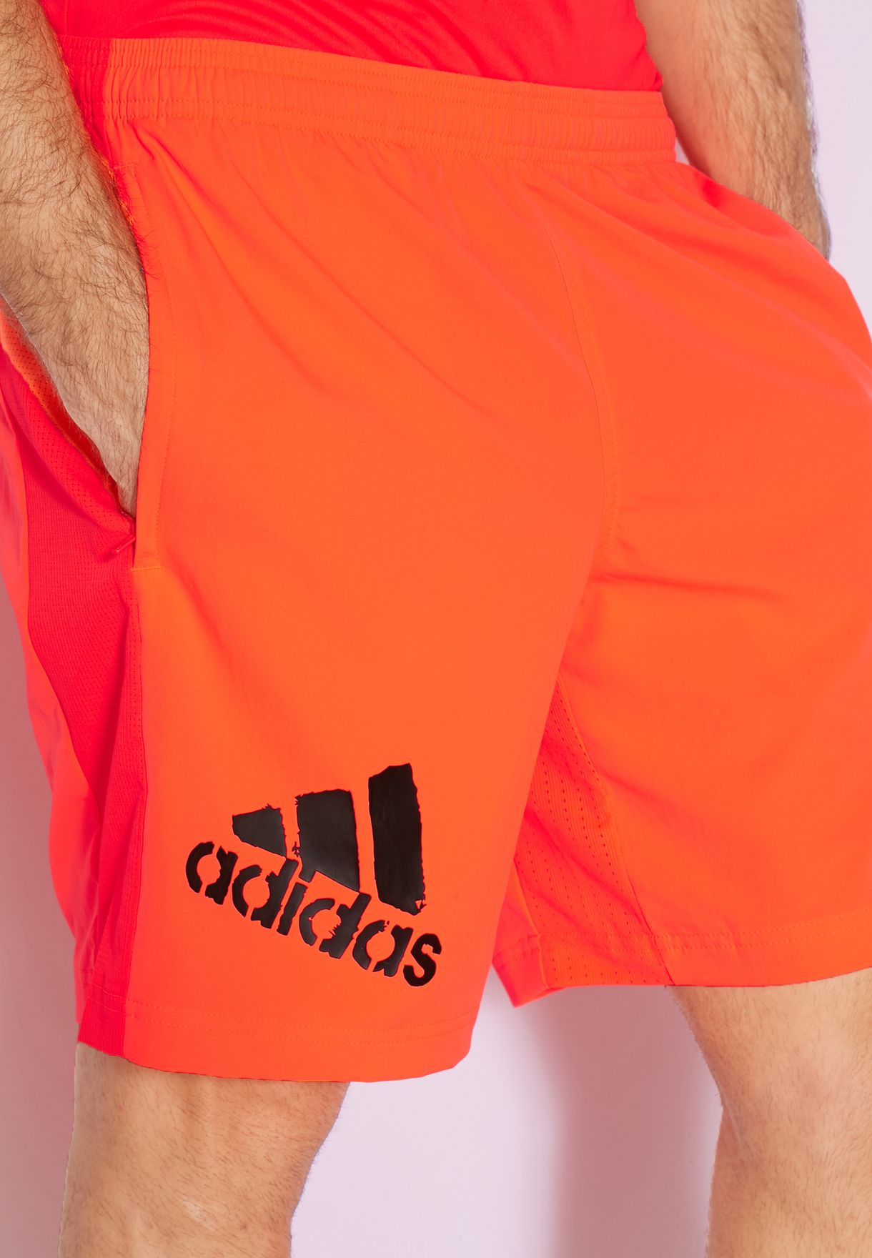 adidas orange shorts and top