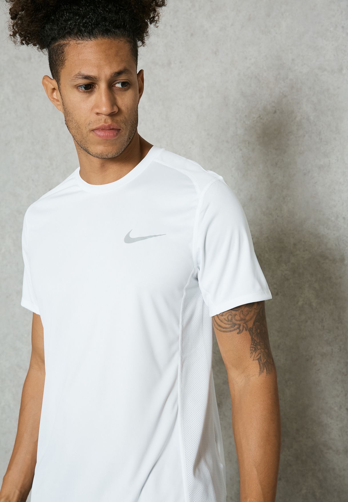 Buy Nike white Dri-FIT Miler T-Shirt 