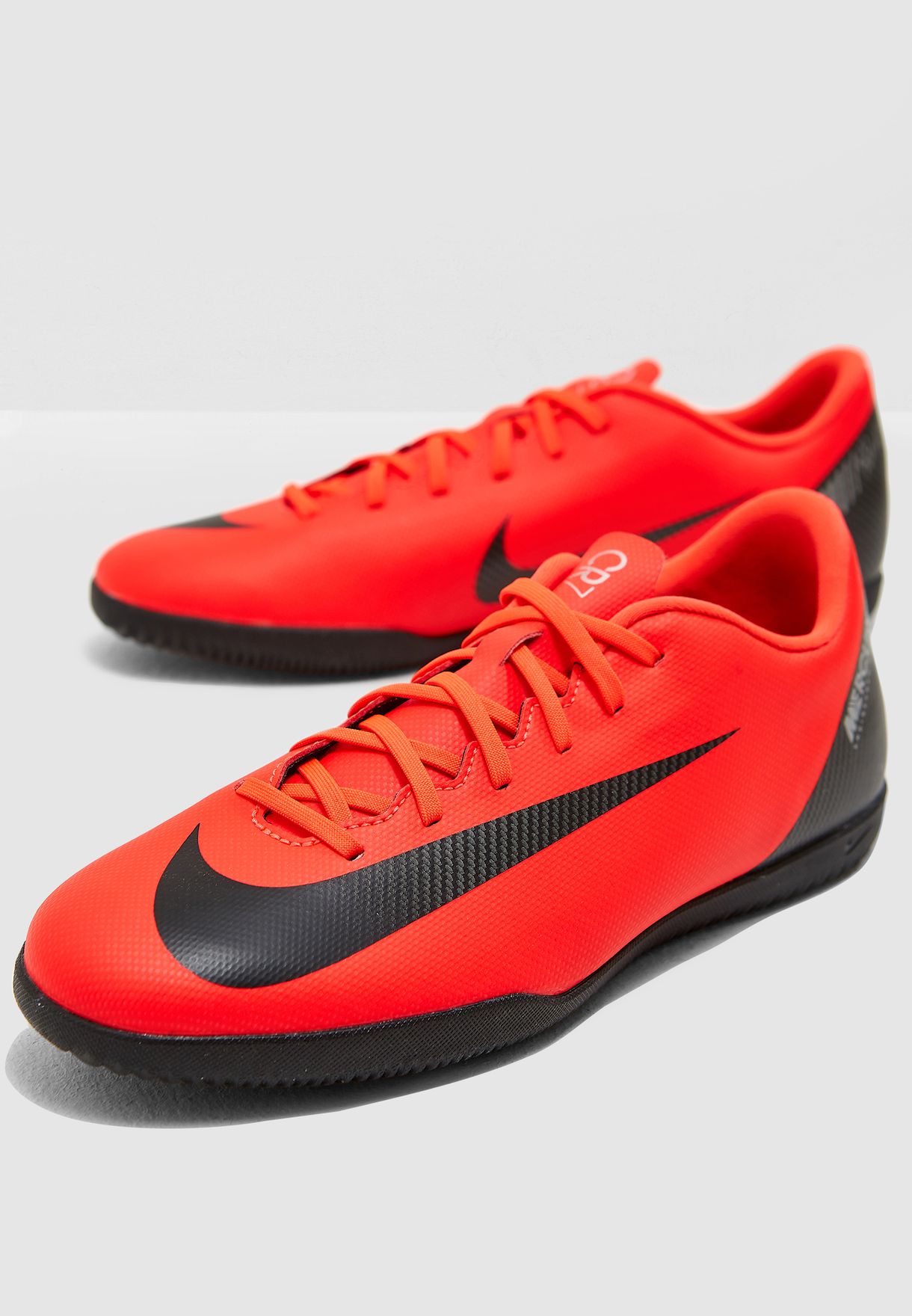 Buy Nike orange Vaporx 12 Club CR7 IC 