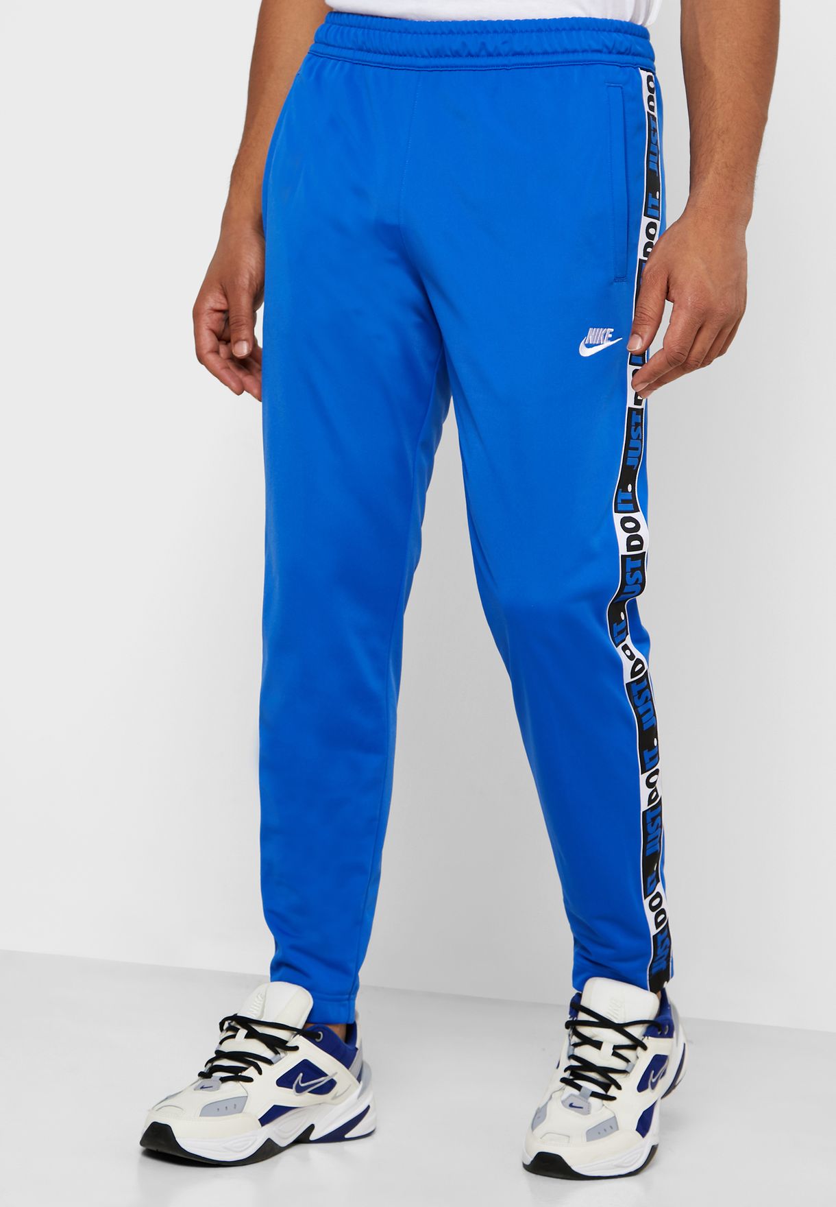Buy Nike blue NSW Just Do It Tape Sweatpants for Kids in Riyadh, Jeddah
