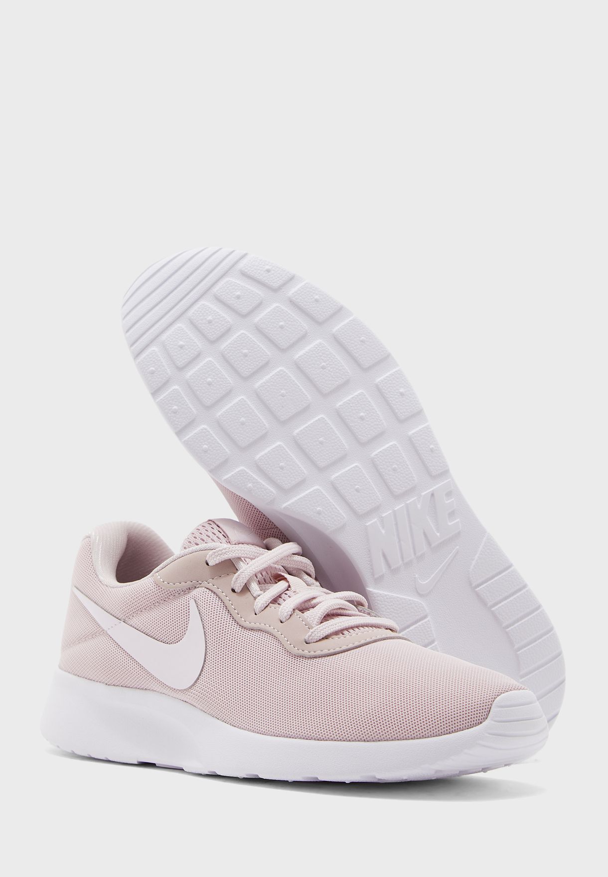 Buy Nike pink Tanjun for Women in MENA 
