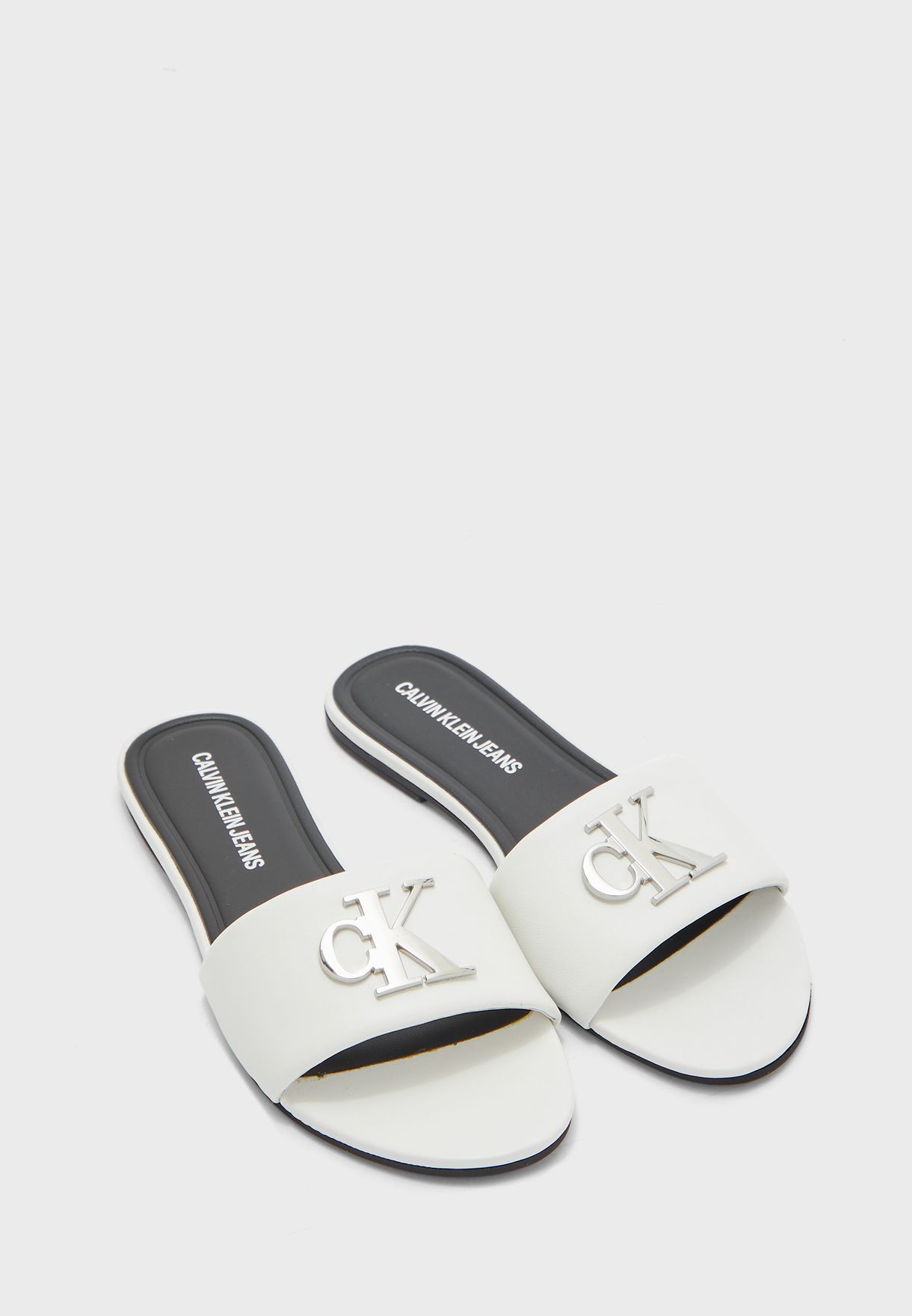 Buy Calvin Klein white Slide Flat Sandals for Women in Manama, Riffa