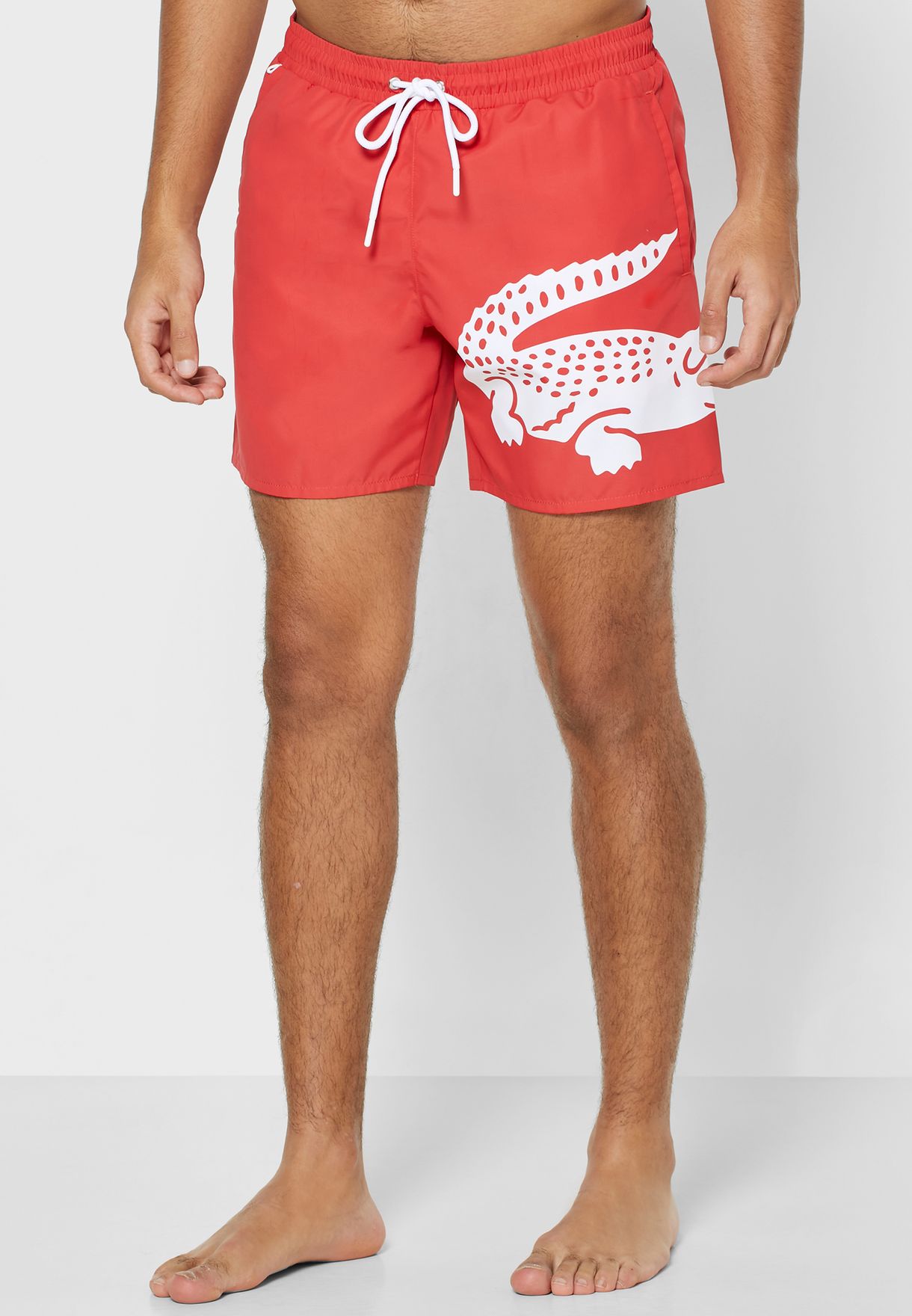 red lacoste swim shorts