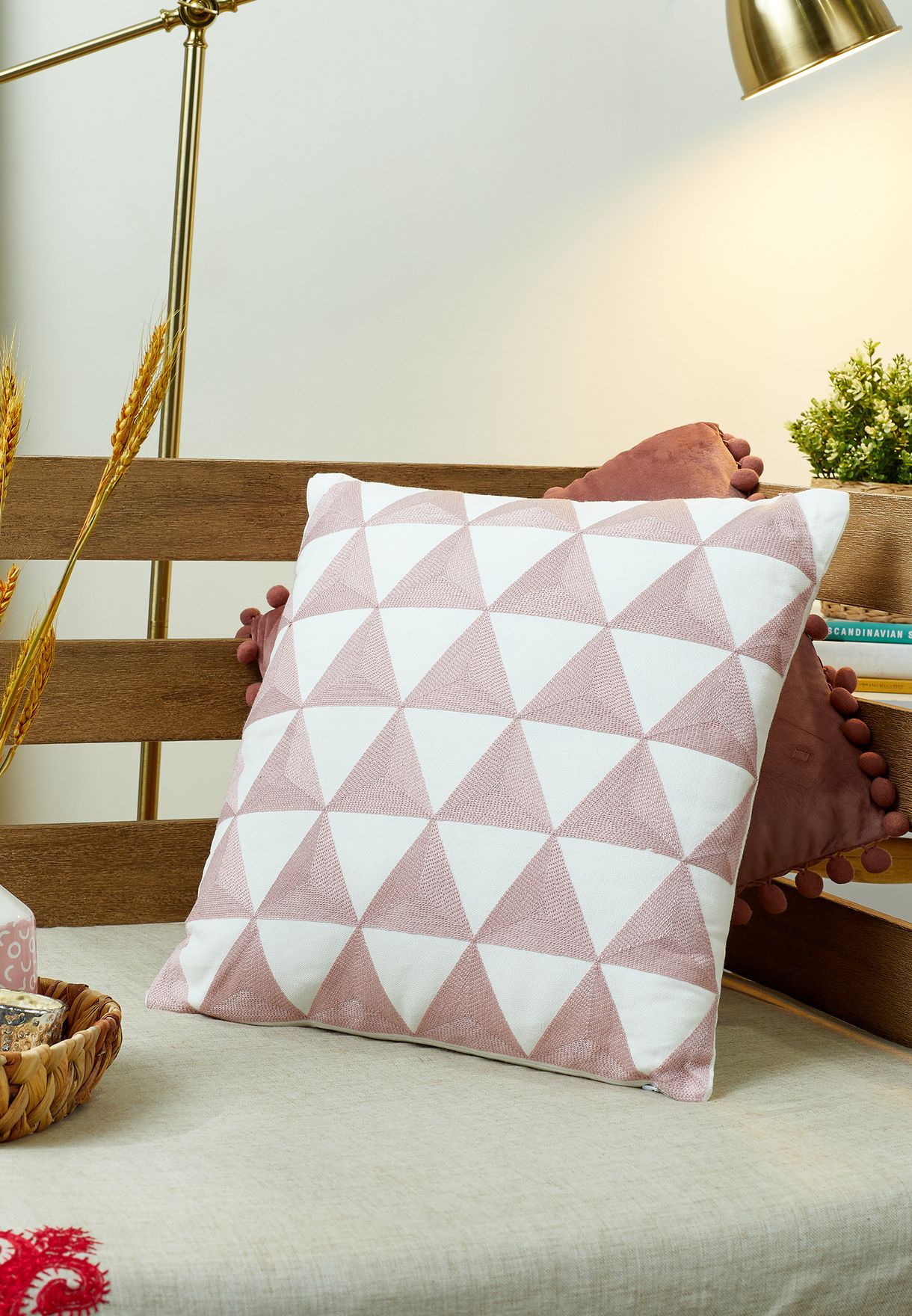 pink embroidered cushion