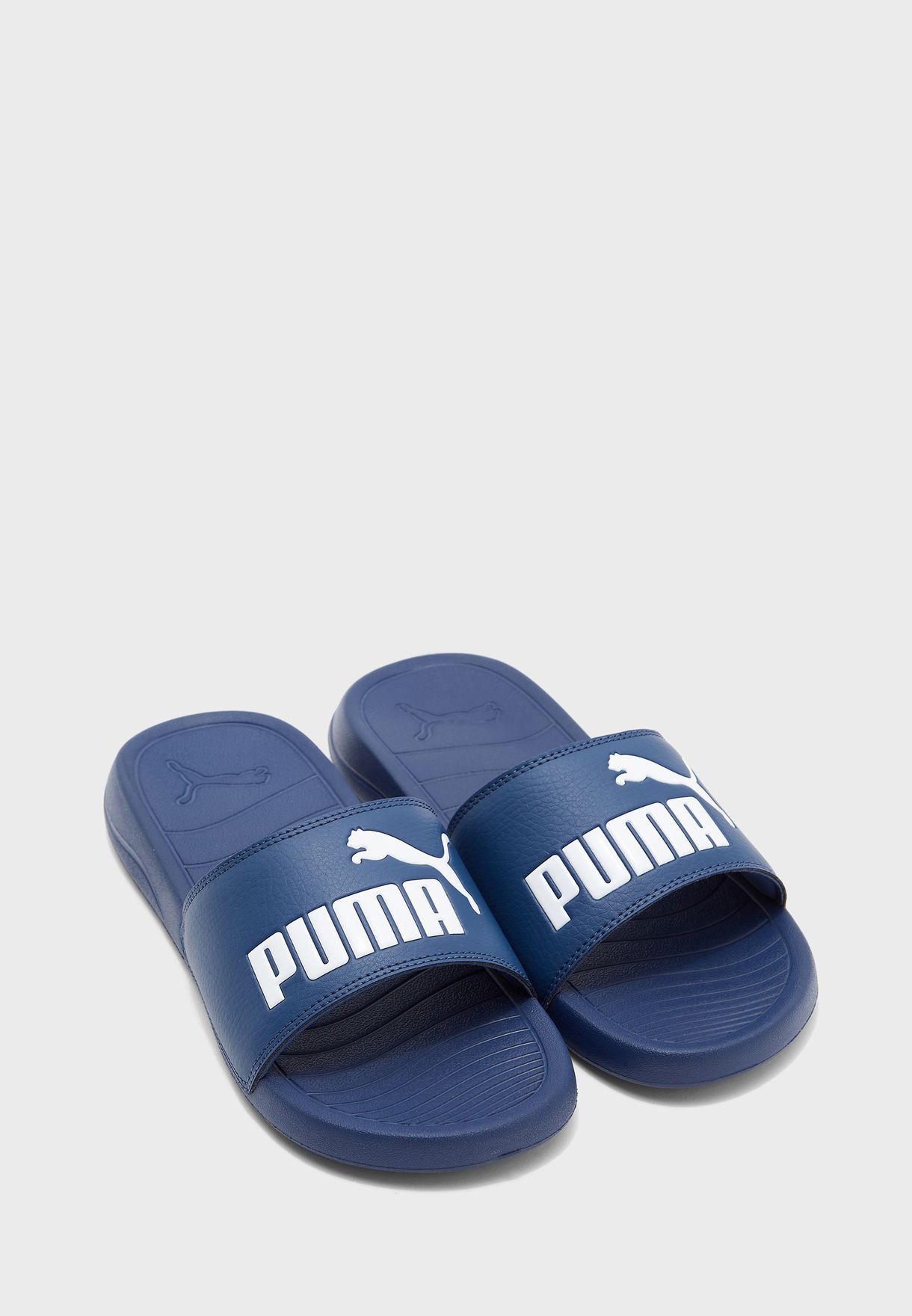 navy blue puma slides