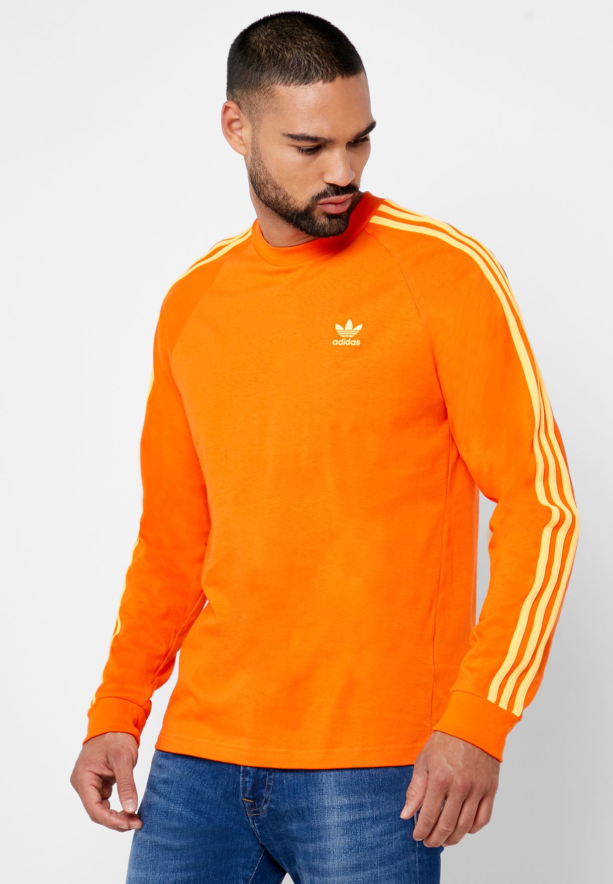 adidas originals three stripe sweatshirt in orange