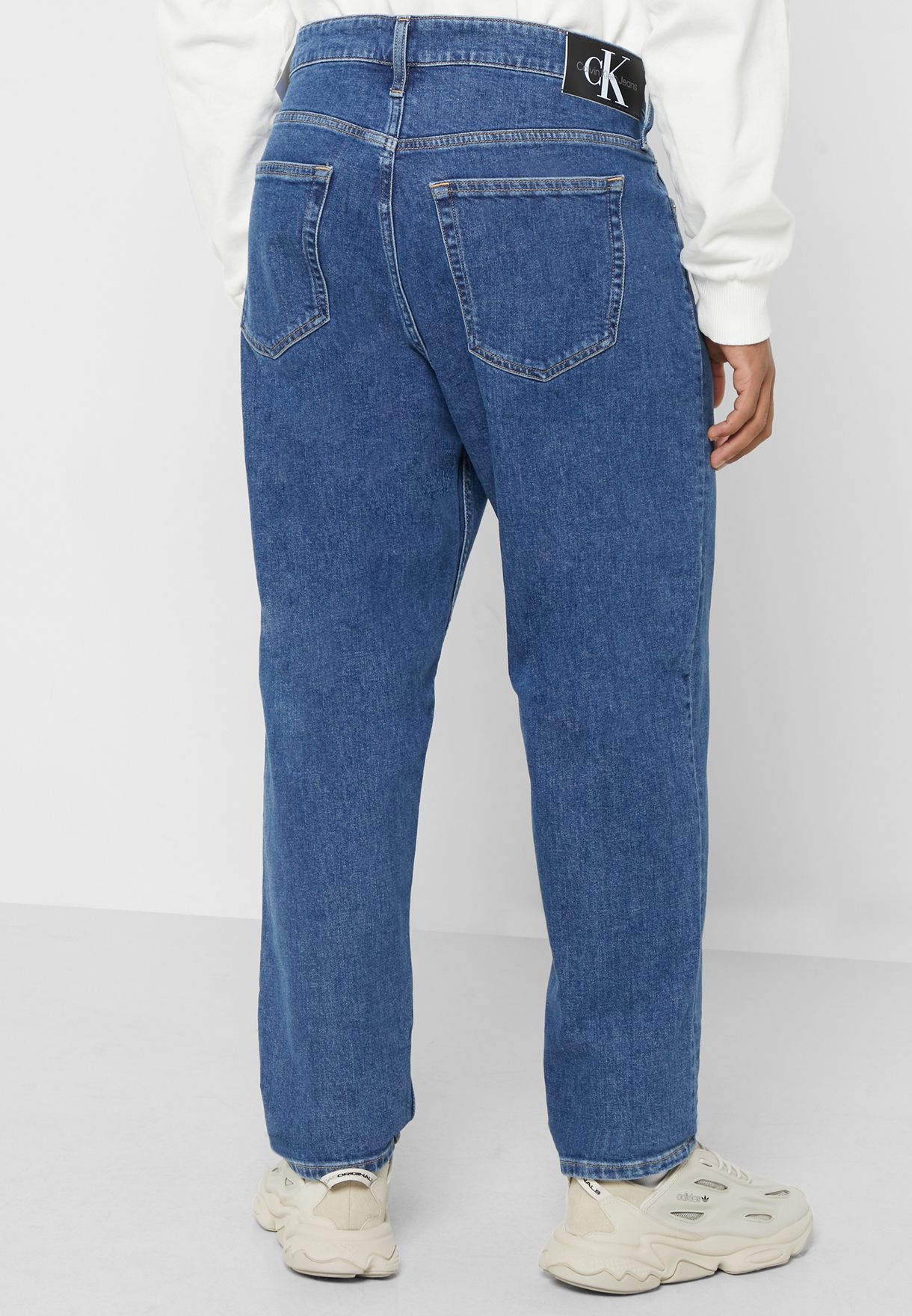 Mid Wash Tapered Fit Jeans