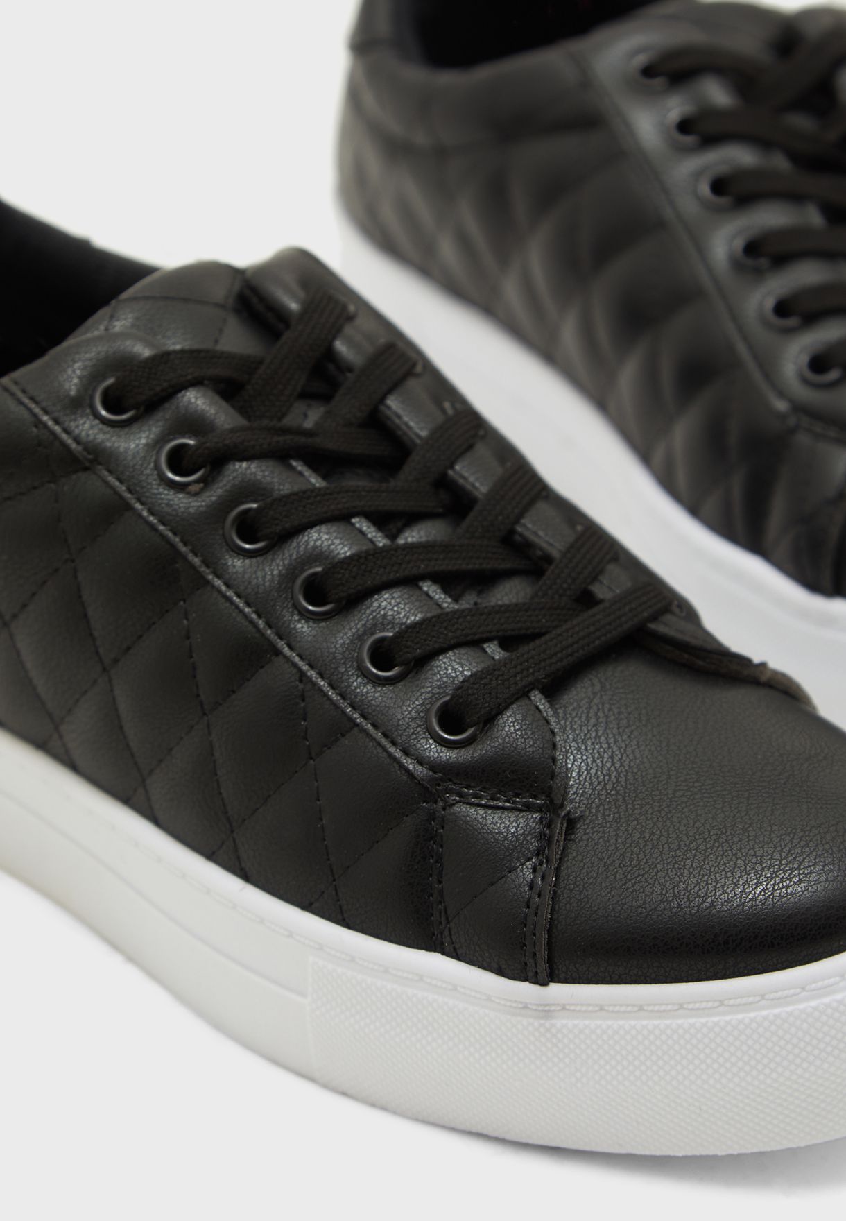 black leather quilted sneakers