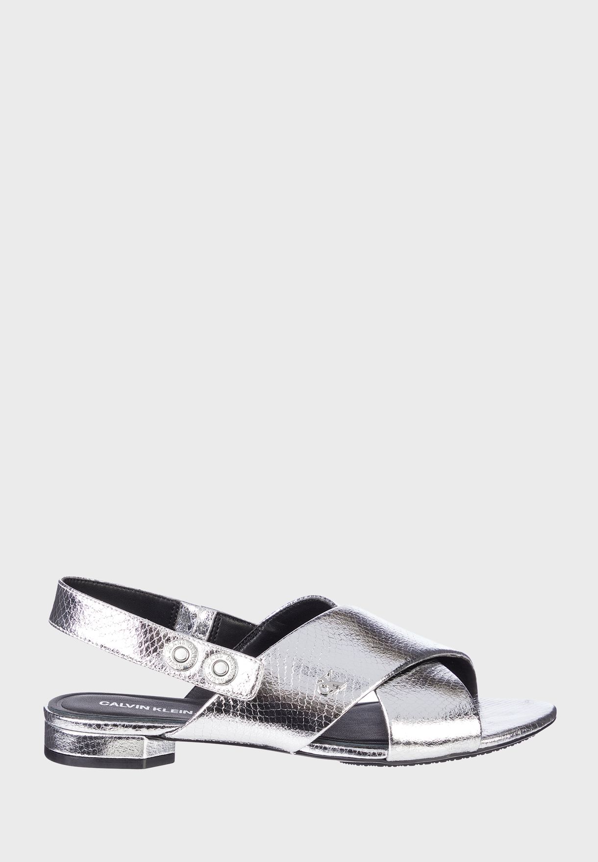 Buy Calvin Klein silver Crisscross Flat Sandal for Women in Riyadh, Jeddah
