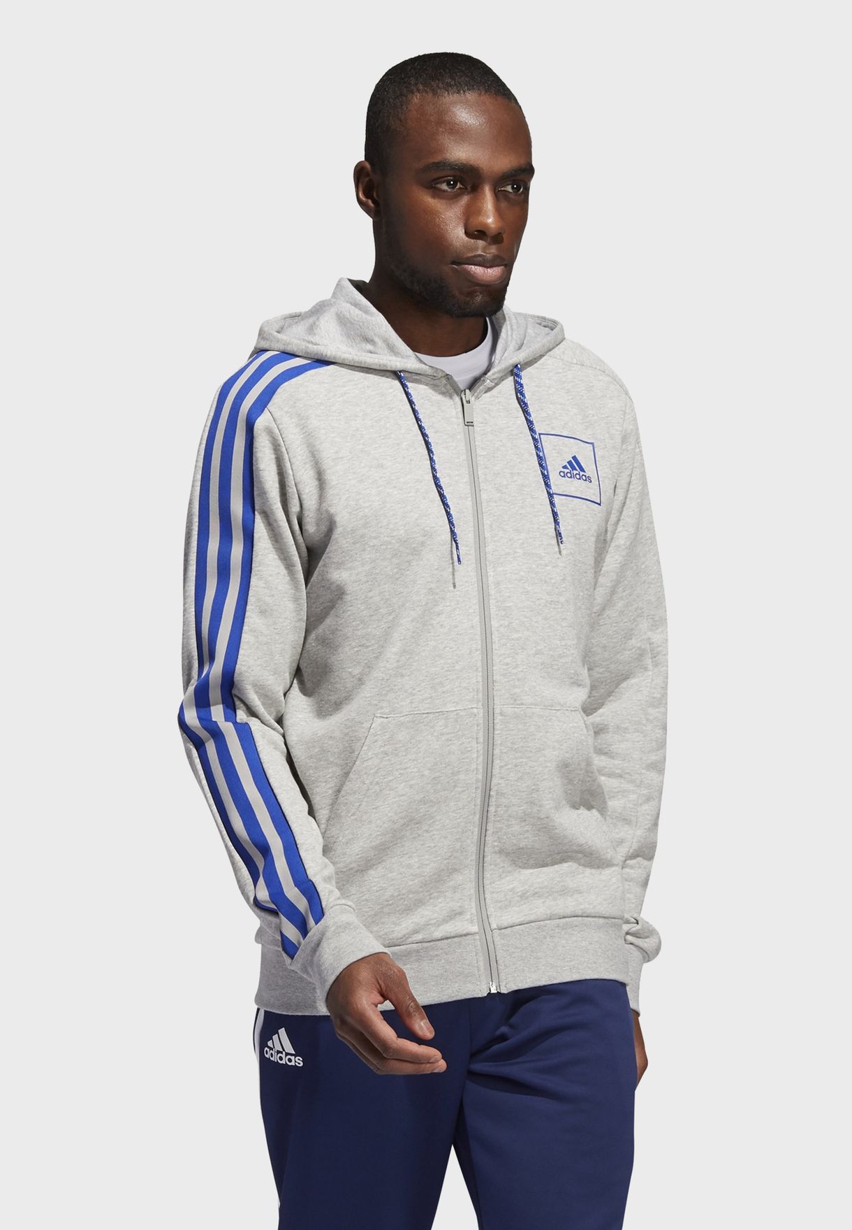 grey adidas hoodie with blue stripes
