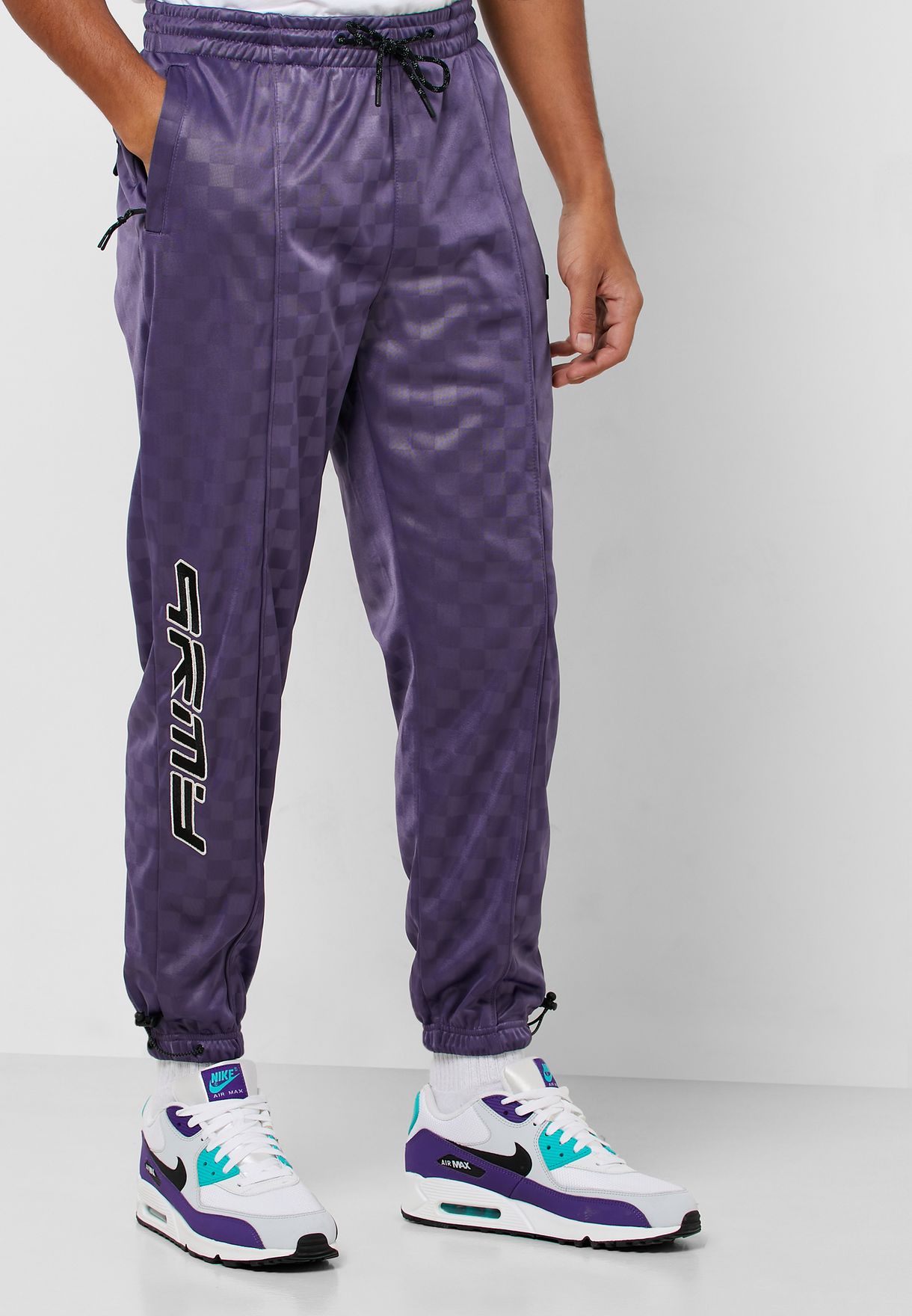 purple nike track pants