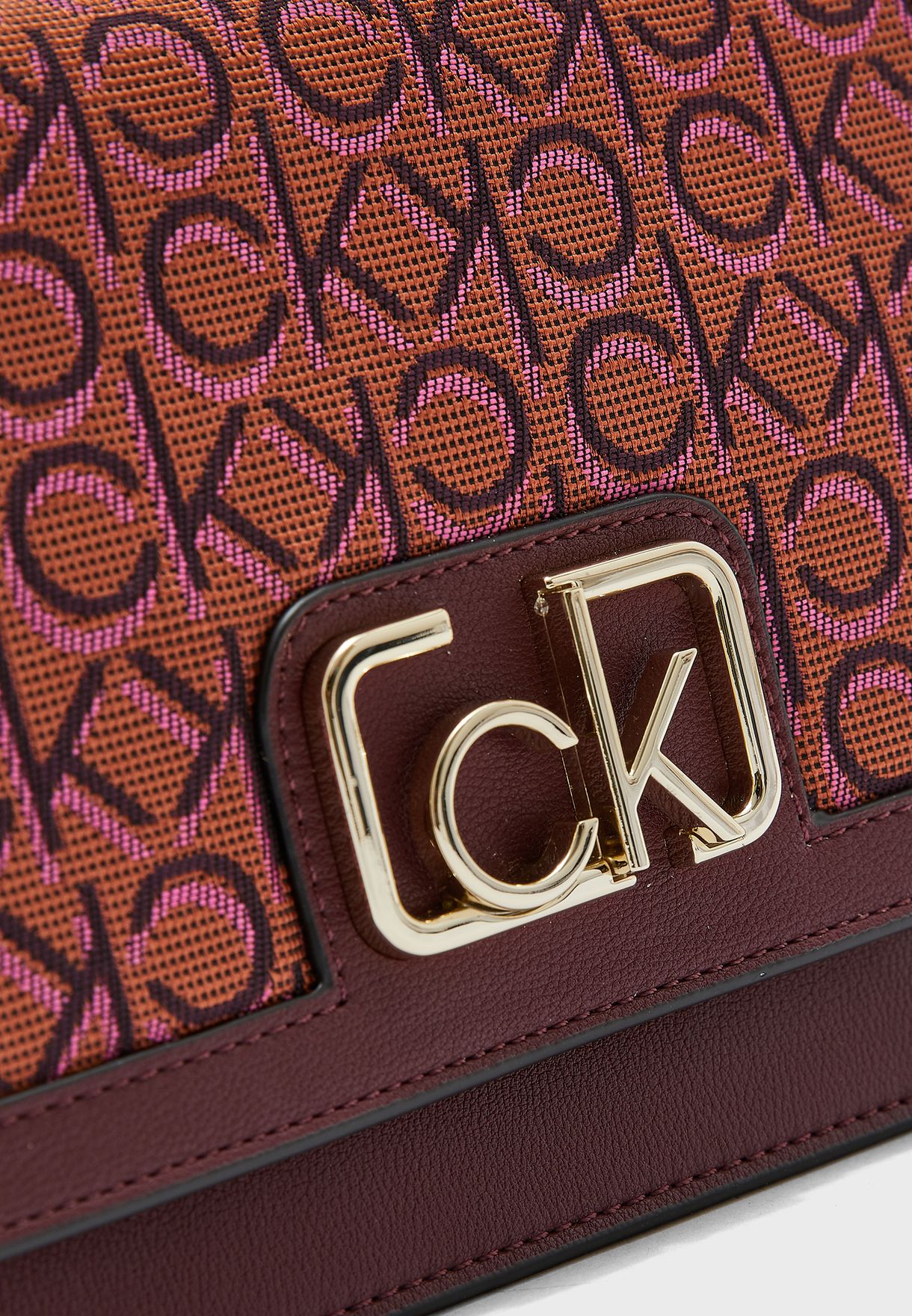 Buy Calvin Klein burgundy Logo Printed Flap Over Crossbody for Women in  Riyadh, Jeddah