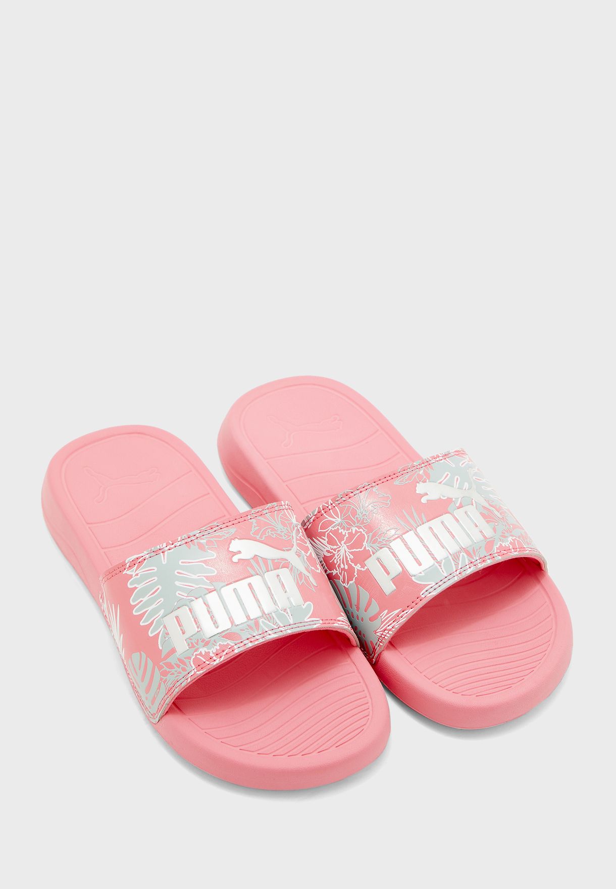 pink and white puma slides