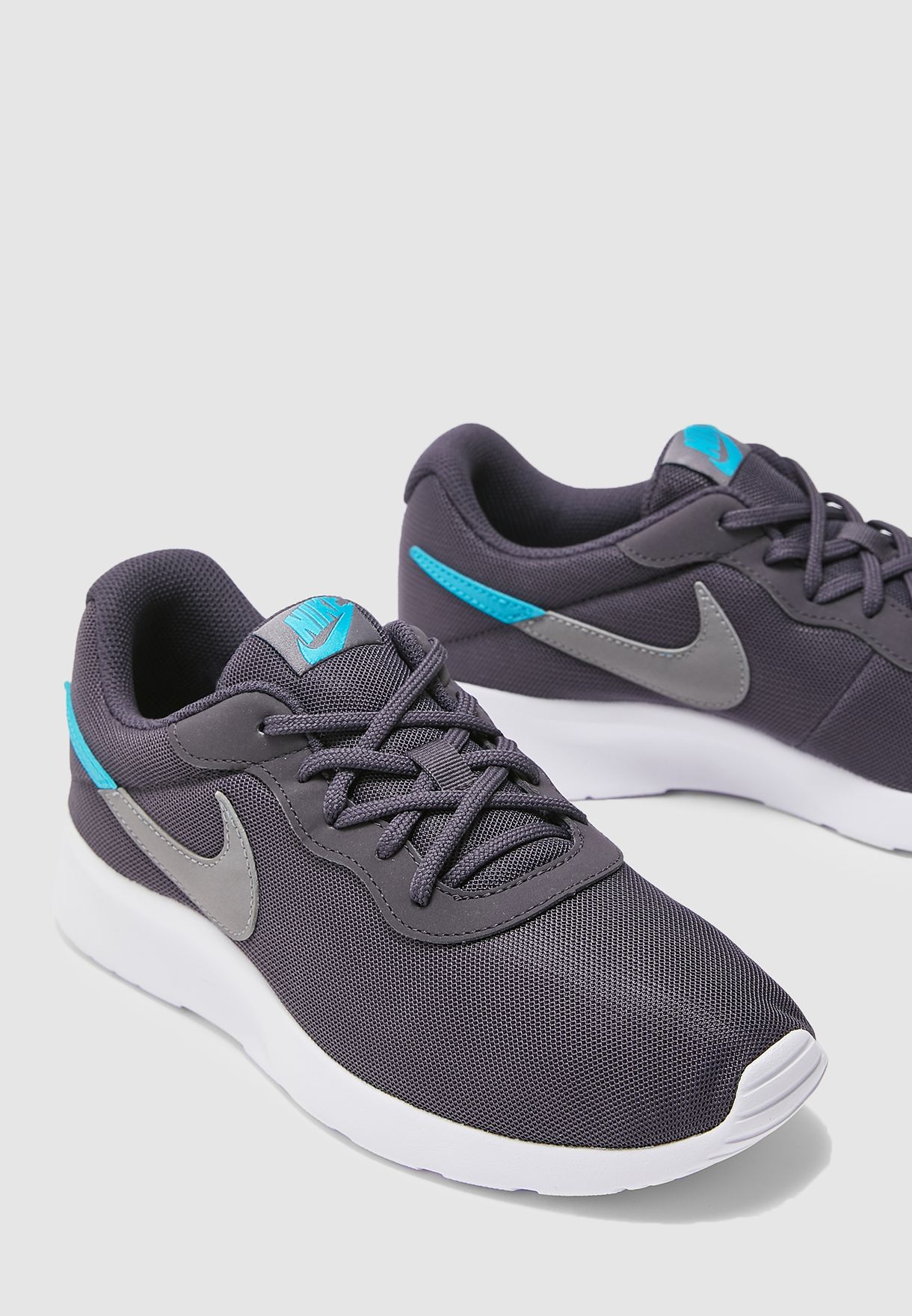 Buy Nike blue Tanjun Swoosh for Men in 