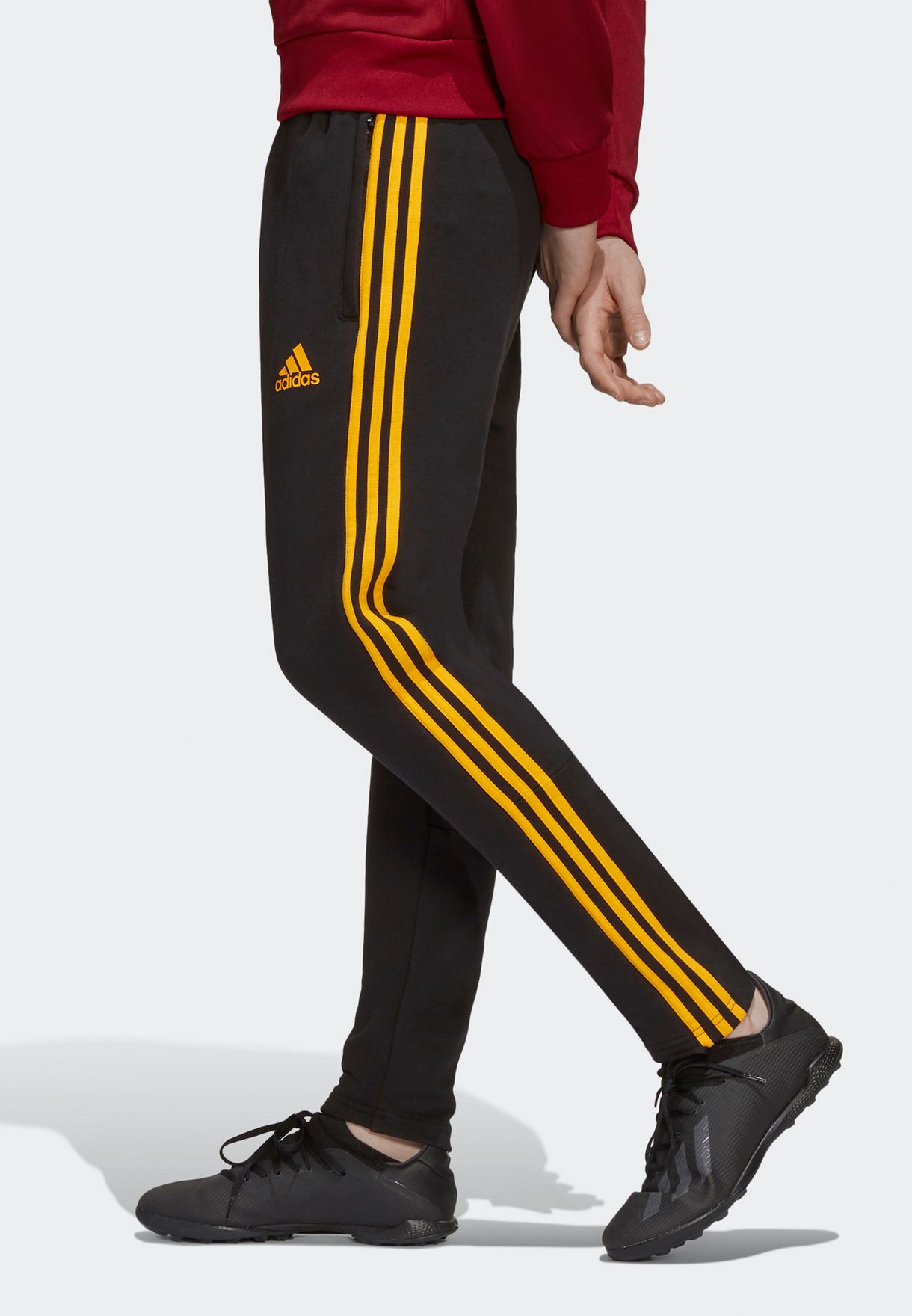 adidas black pants with gold stripes