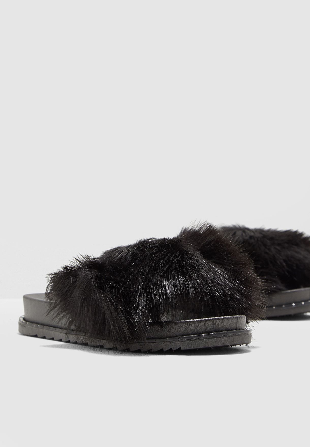 black faux fur slides