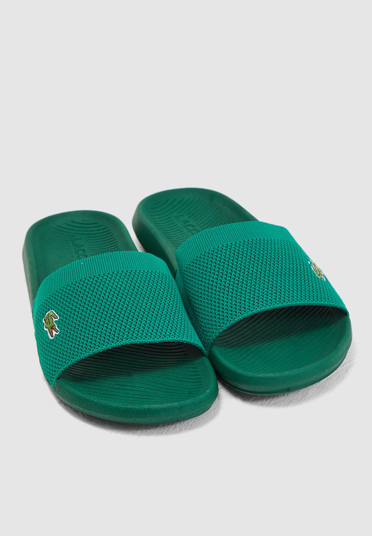 green lacoste slides
