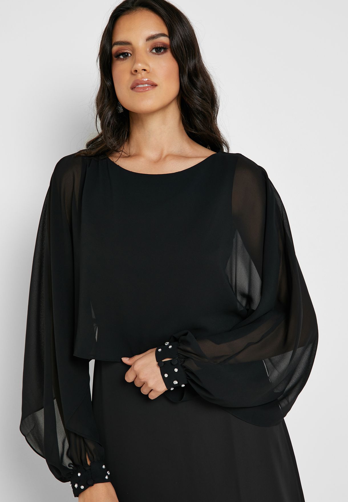 black bodysuit with a black mesh overlay dress