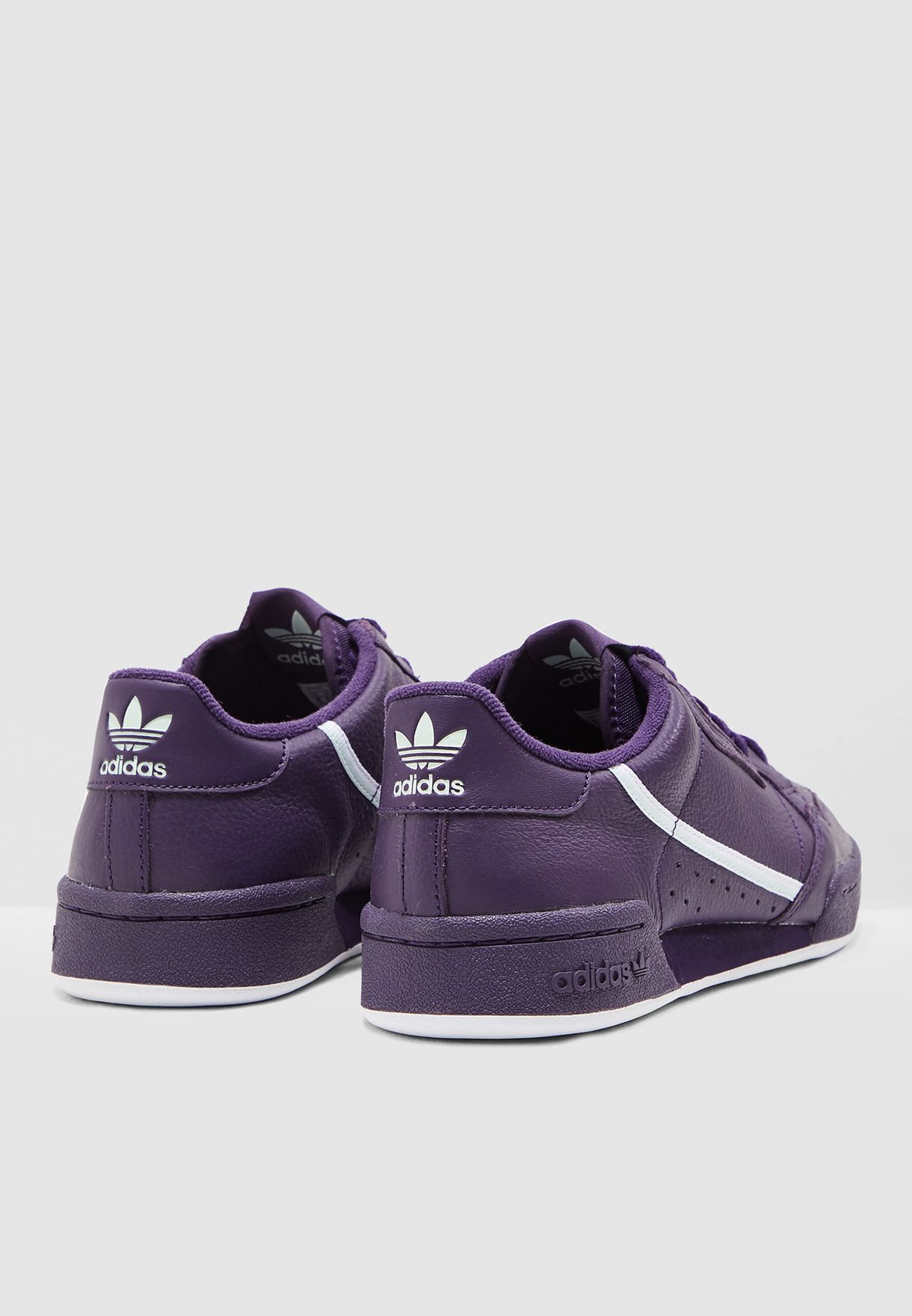 purple adidas continental 80