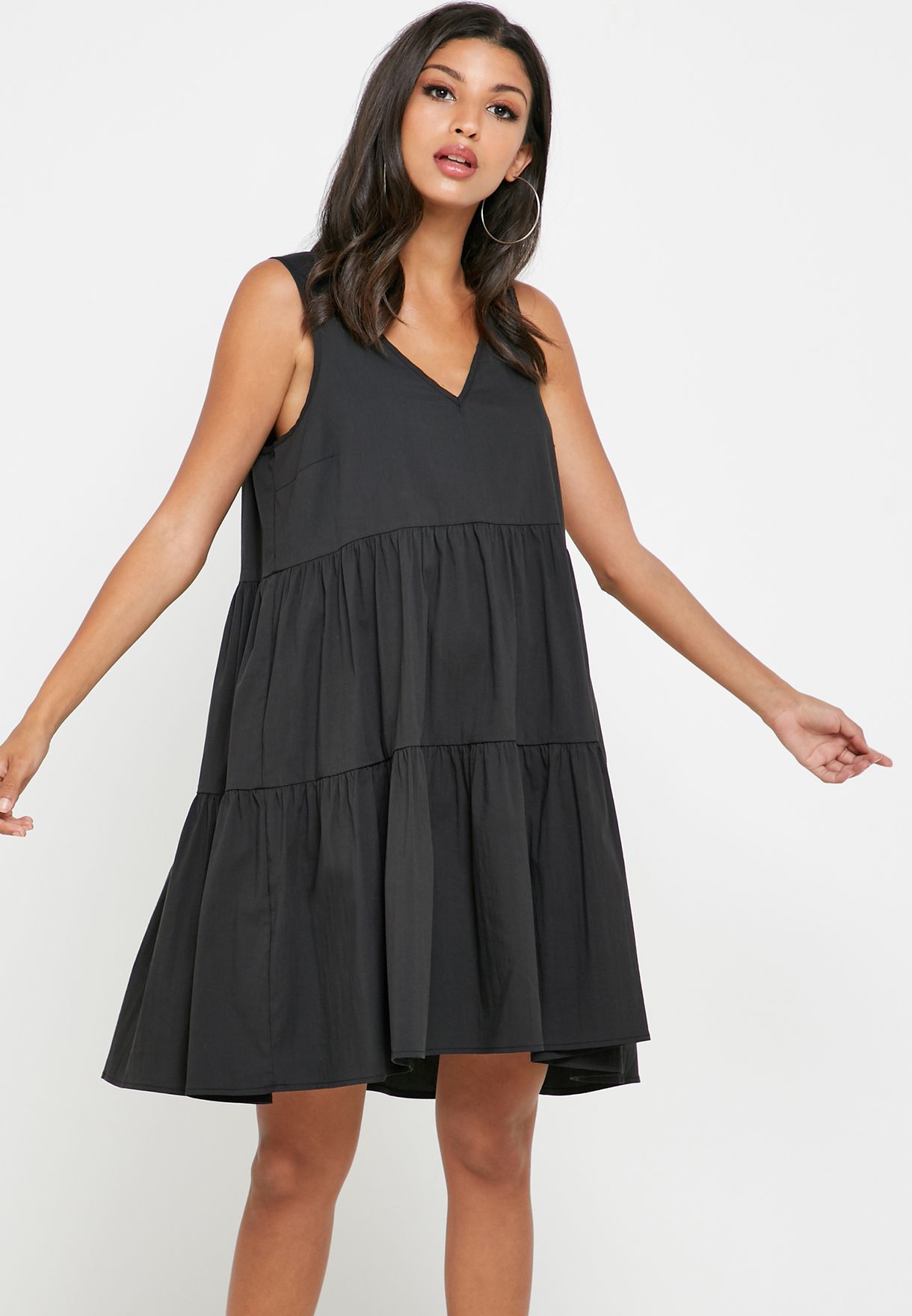 black tiered sleeveless dress