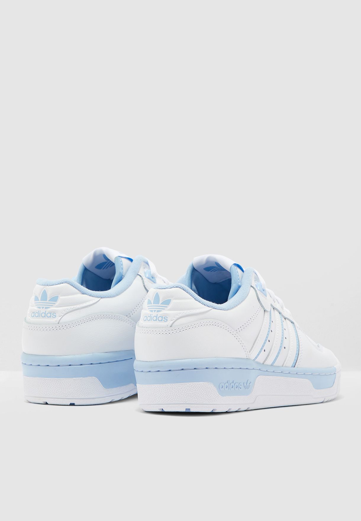 adidas originals rivalry low trainer in blue and pink