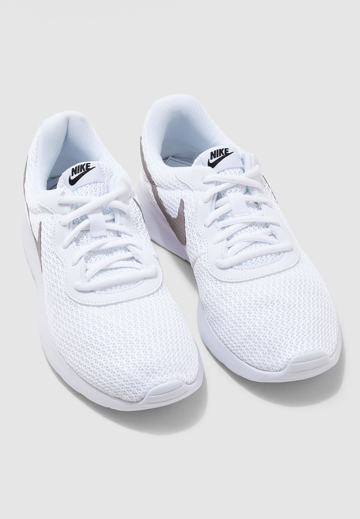 nike white tanjun trainers