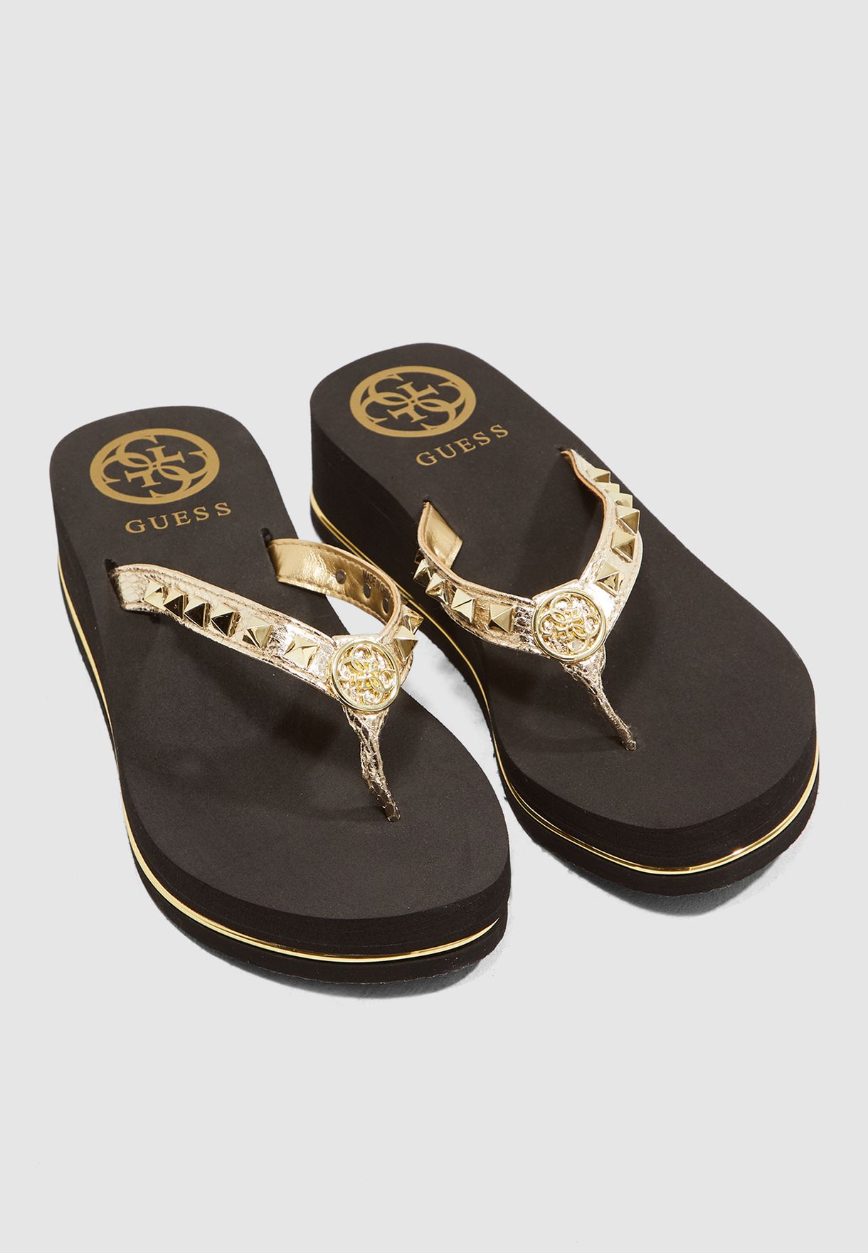 guess gold flip flops