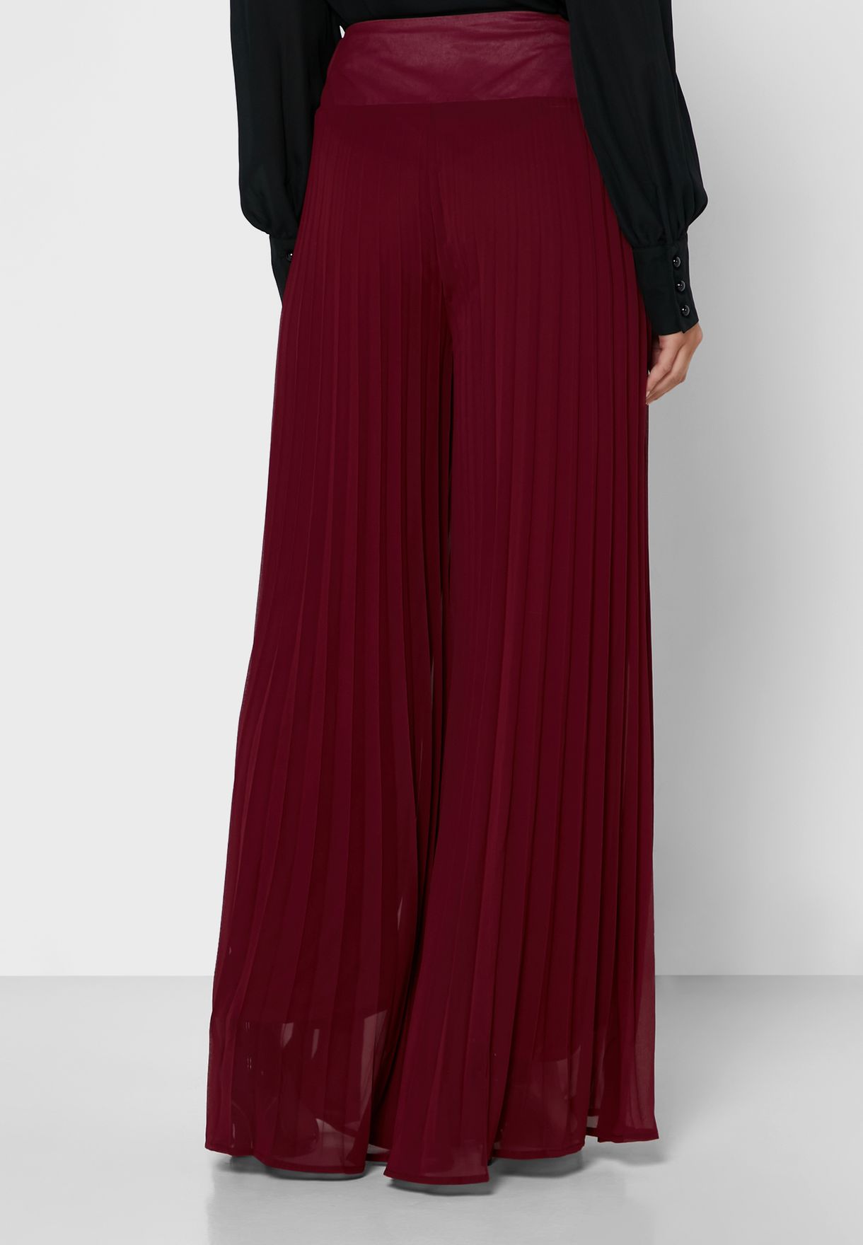 red pleated pants