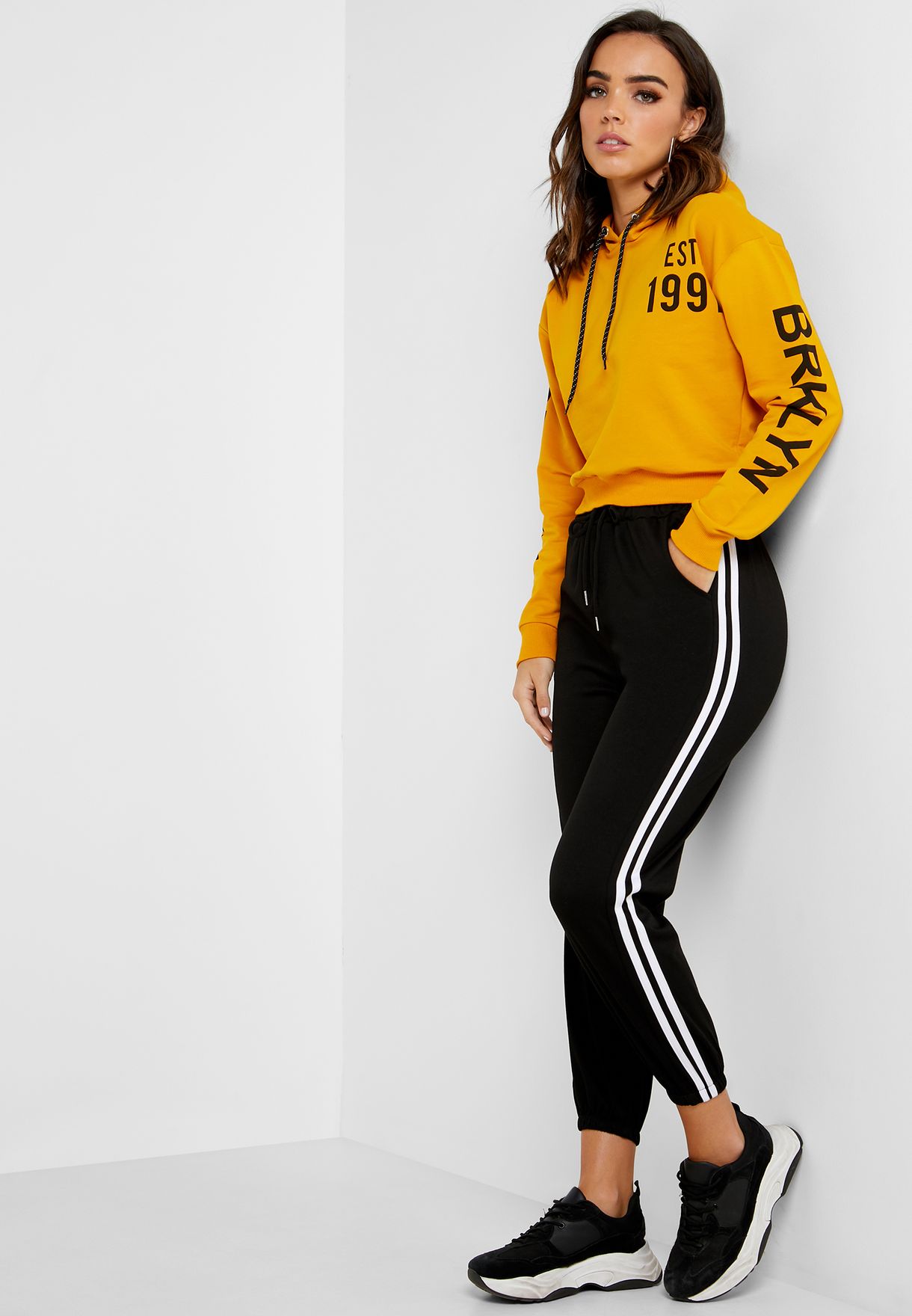 black joggers with yellow side stripe