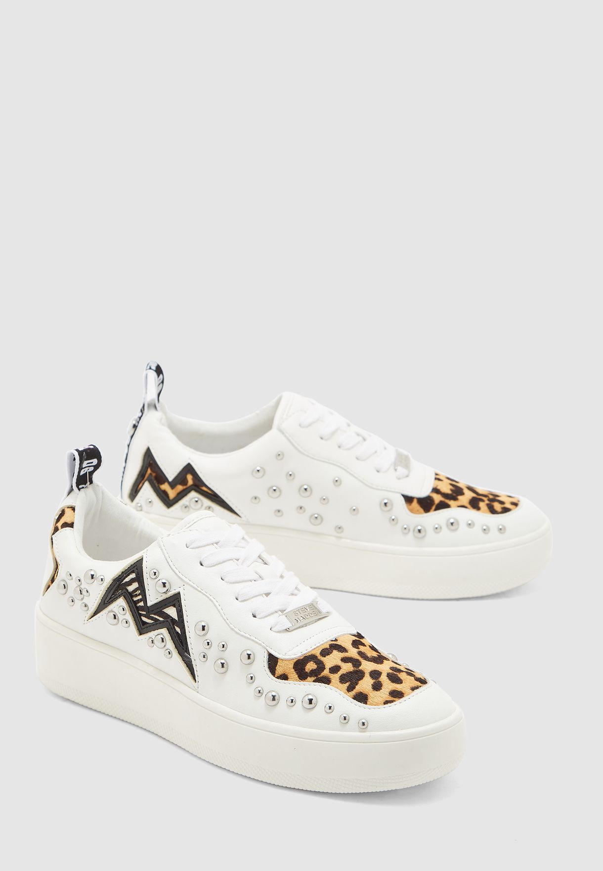 white sneakers with leopard