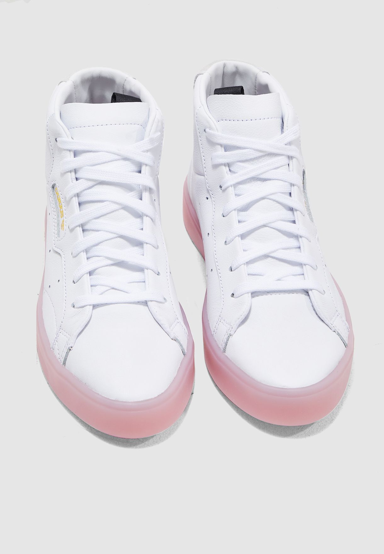 adidas originals sleek mid top sneaker in white and pink