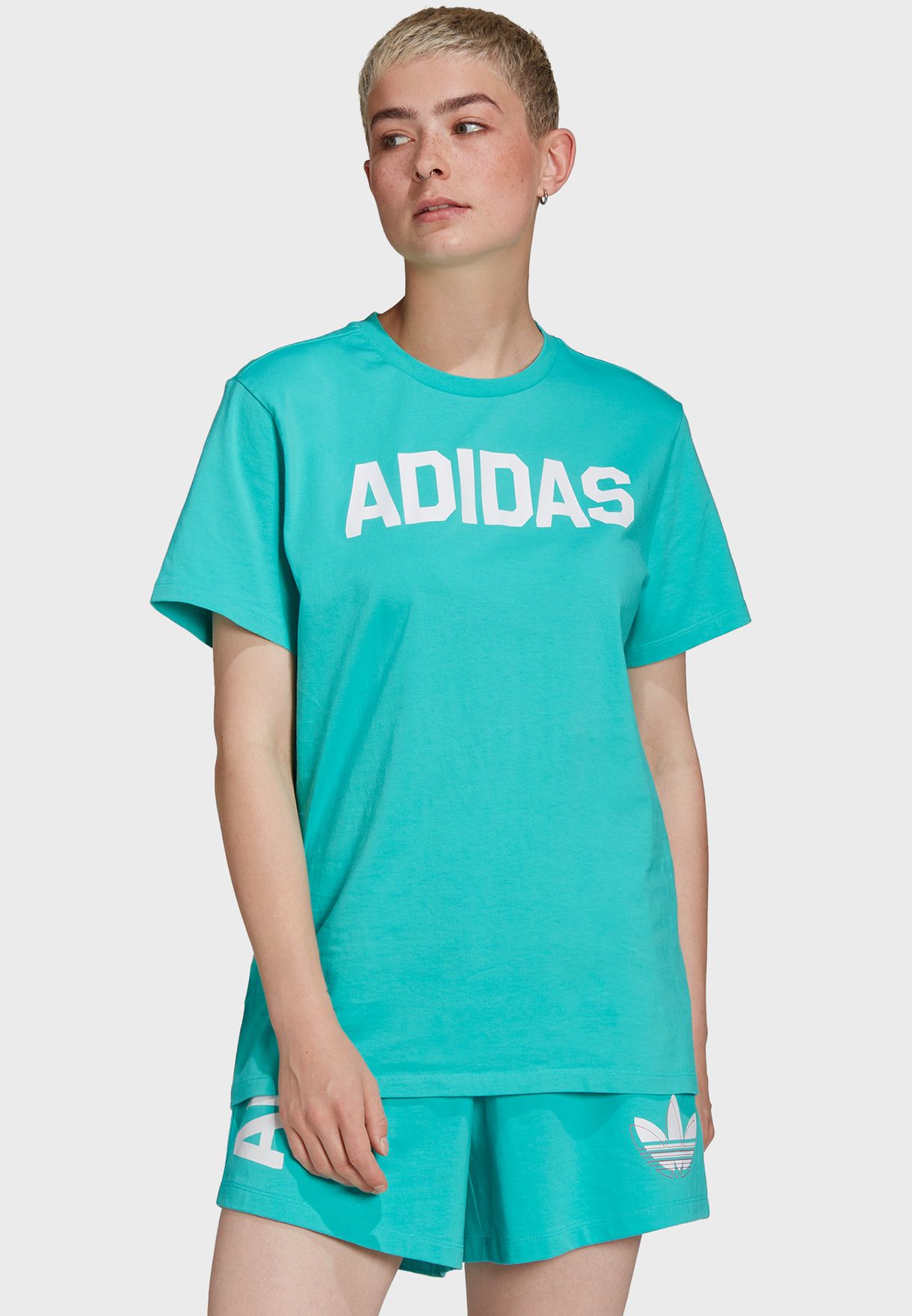 pink and green adidas shirt