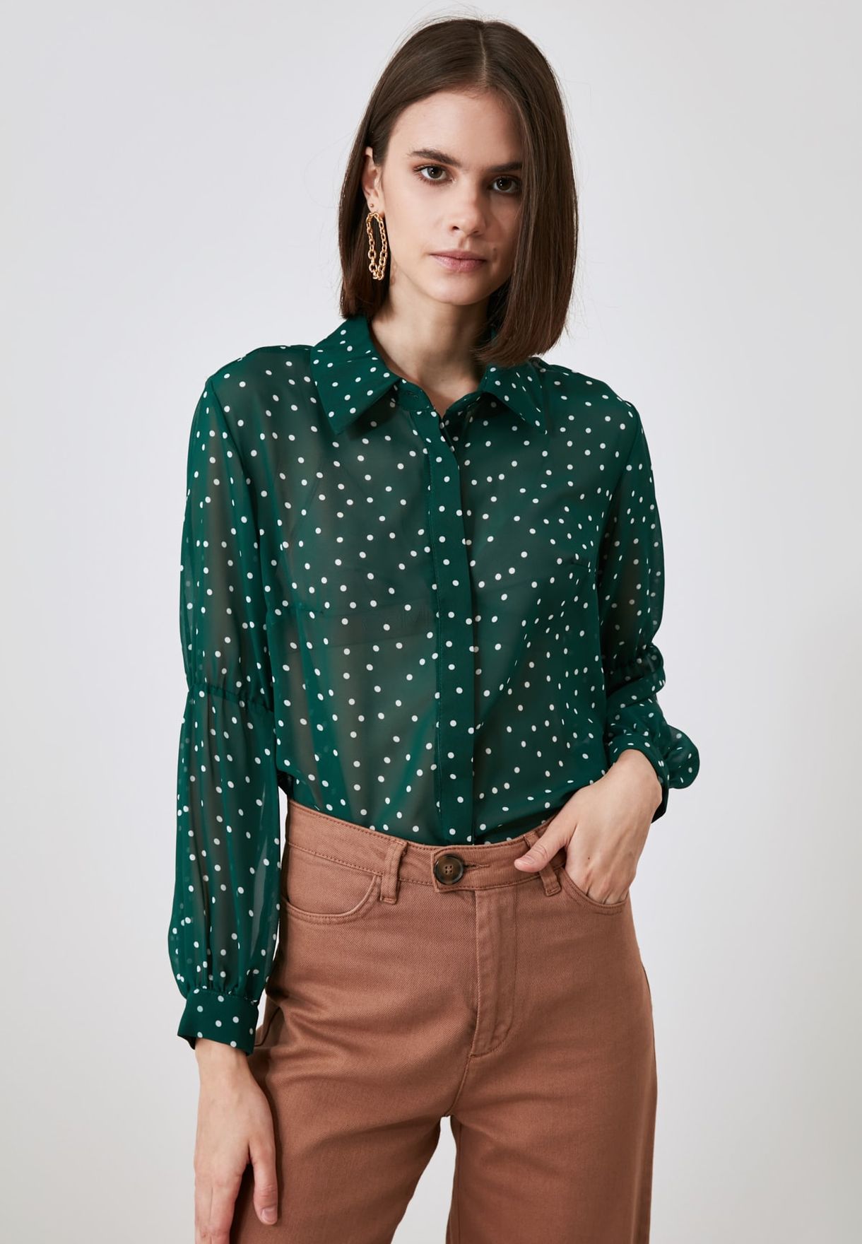 green polka dot shirt