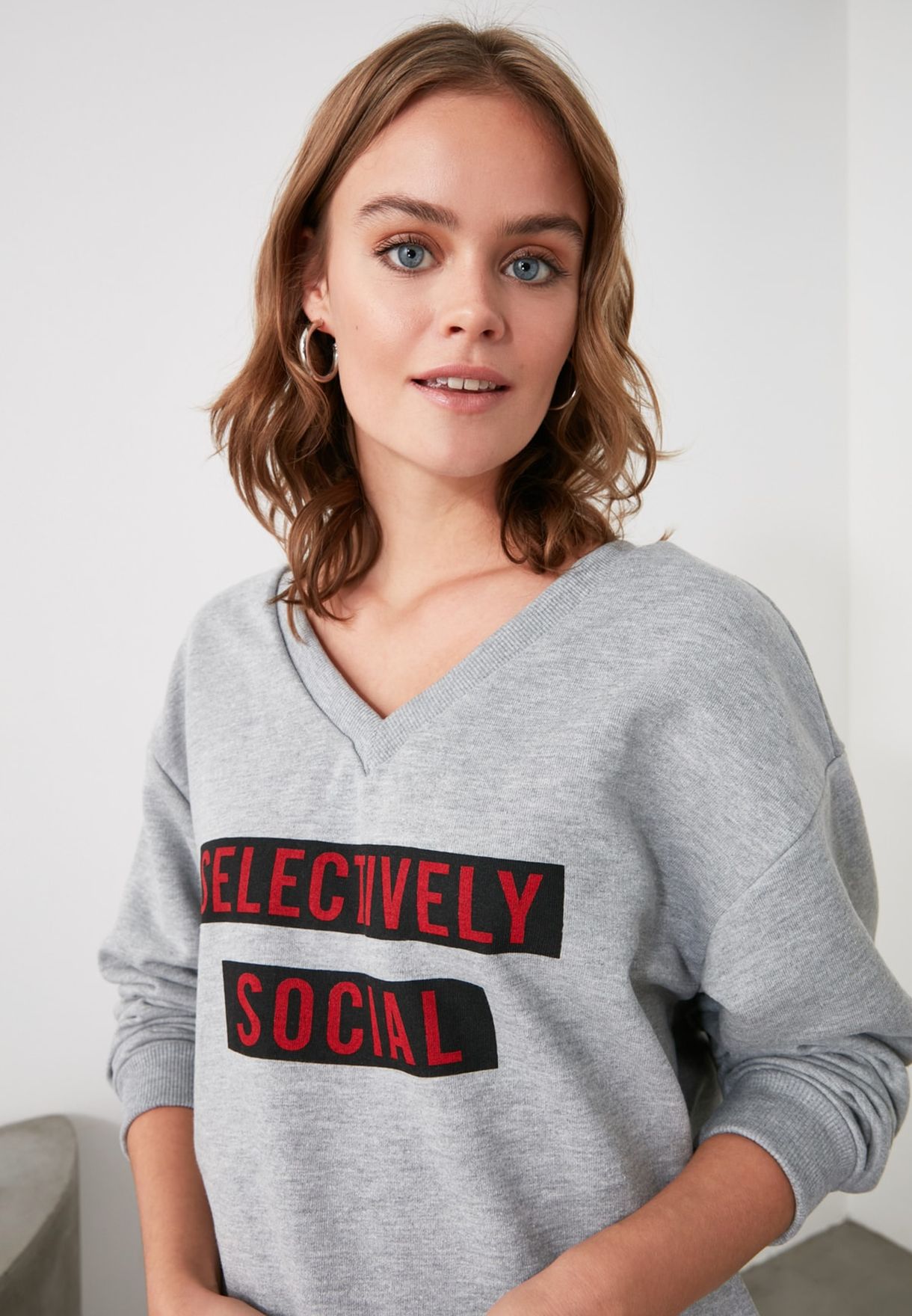 grey v neck sweatshirt