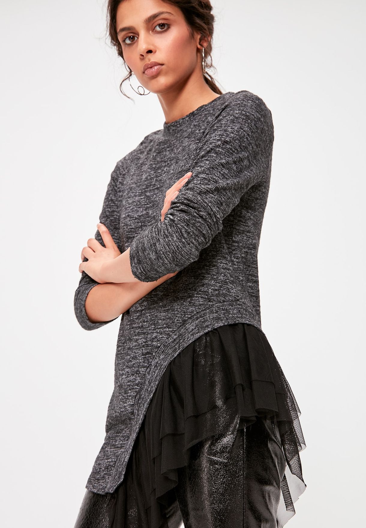 asymmetrical top with ruffles on the hem